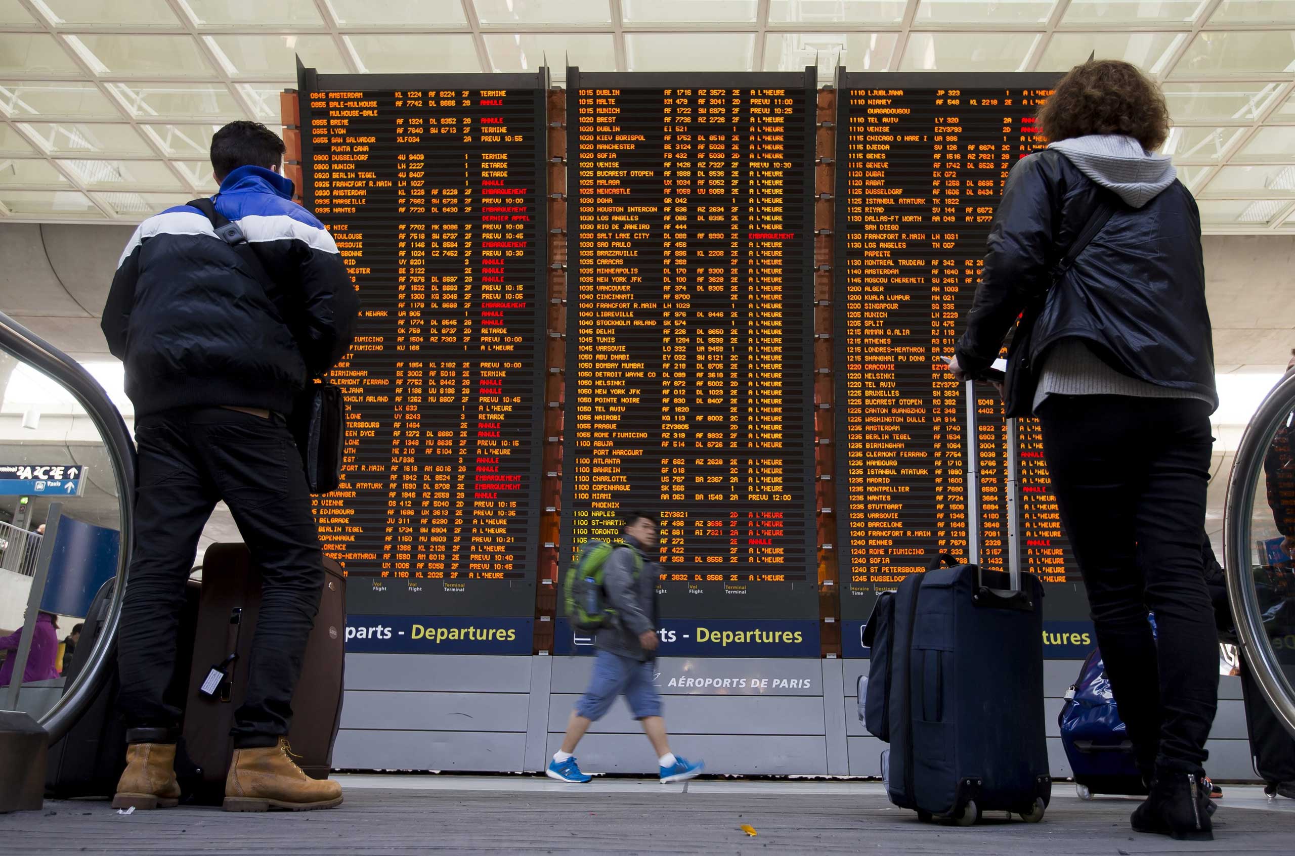 Travellers check a flight information board with various of them listed as 'cancelled' due to a strike of air traffic controllers at the Charles de Gaulle internation airport's terminal 2, in Roissy, near Paris, April 8, 2015. (Ian Langsdon—EPA)