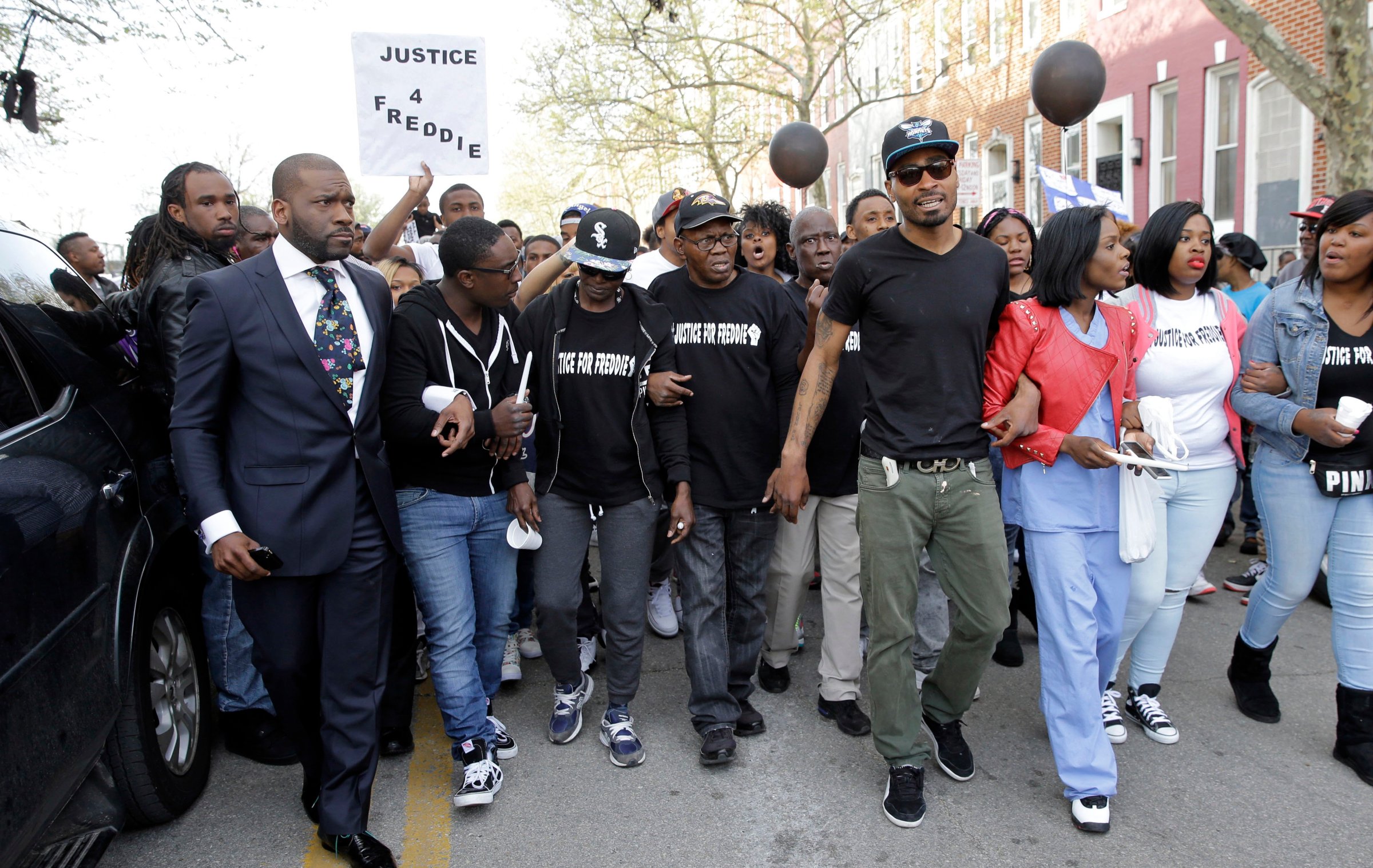 Gloria Darden, third from left, mother of Freddie Gray, walks with supporters and family members of Gray in a march to the Baltimore Police Department's Western District police station during a vigil for Gray on April 21, 2015, in Baltimore.