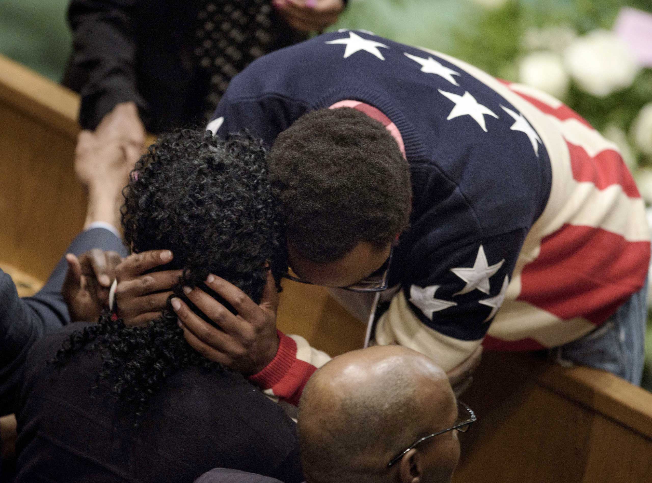 Gloria Darden, mother of Freddie Gray, is embraced before her son's funeral at New Shiloh Baptist Church in Baltimore on April 27, 2015.
