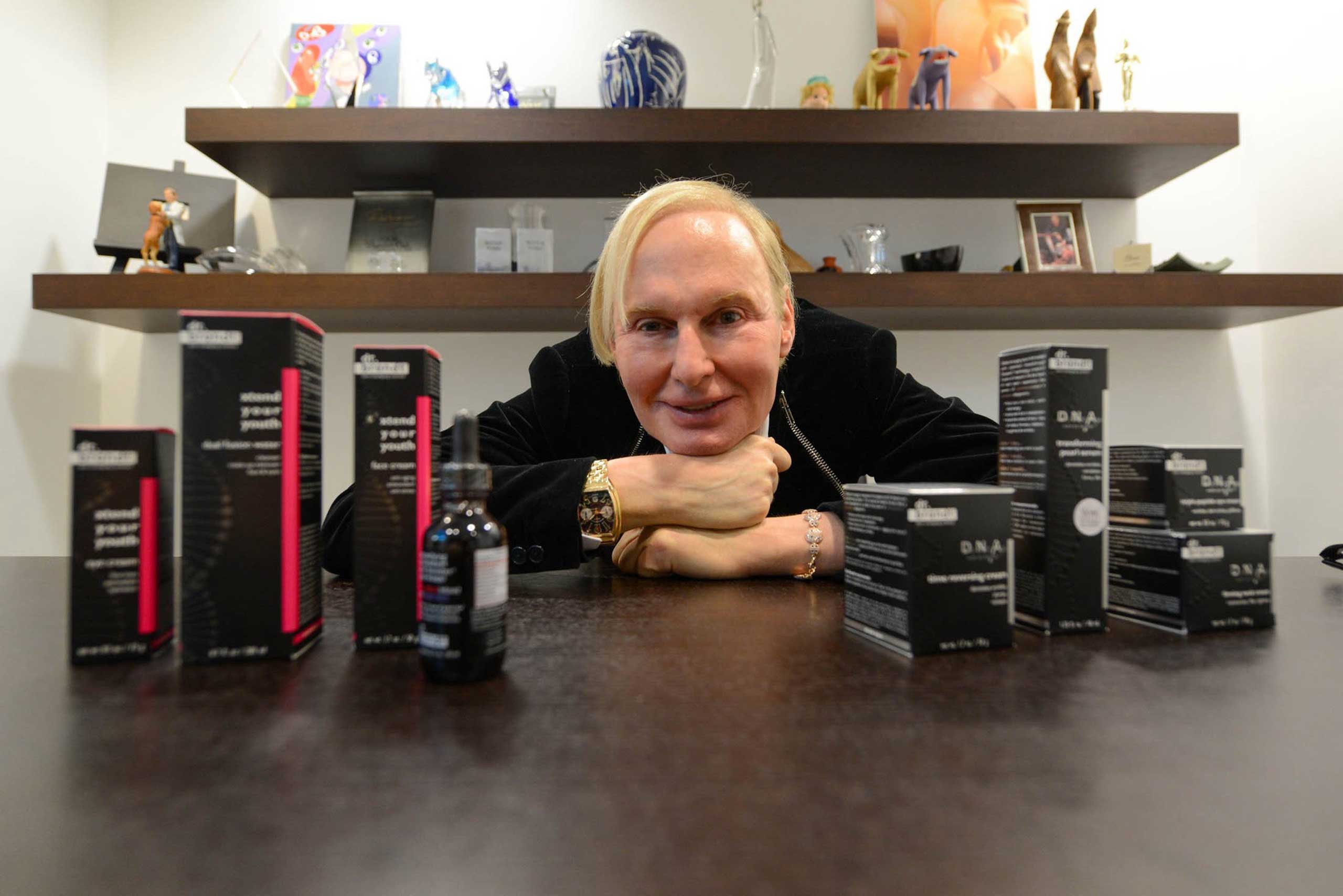 Dermatologist Dr. Fredric Brandt poses for a portrait with his newest additions to his skin-care line, Nov. 19, 2013, in Miami. (Shannon Kaestle—MCT/Getty Images)