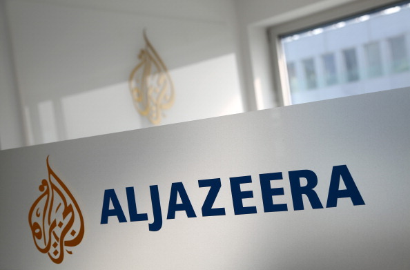 A logo is seen at the Al Jazeera bureau in Berlin on Feb. 27, 2014 (Adam Berry—Getty Images)