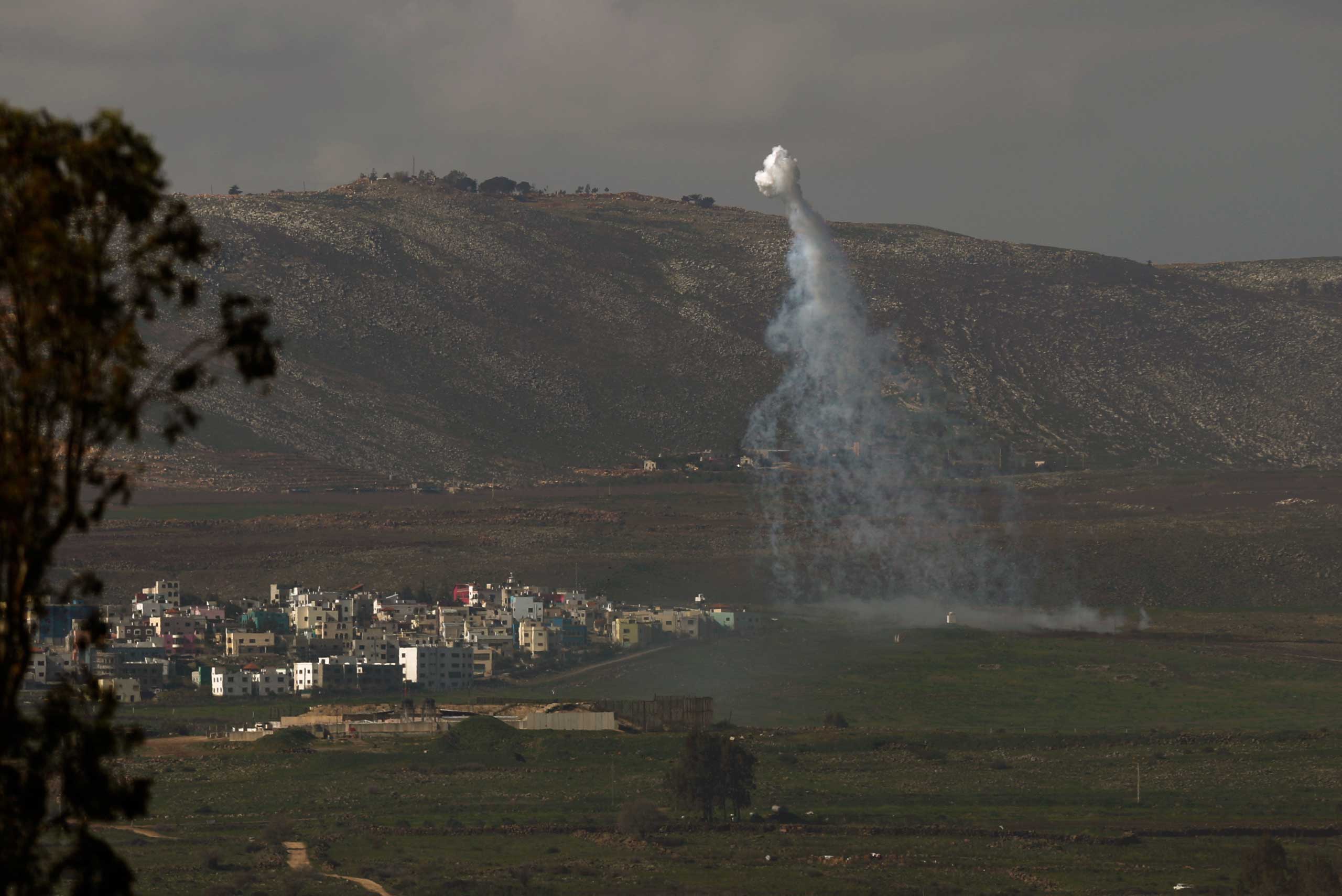 Smoke rises next to the village of Ghajar on the Israeli-Lebanese border, as a result of the fire exchange between the Israeli and Hizballah militant group on Jan. 28, 2015. (Atef Safadi—EPA)