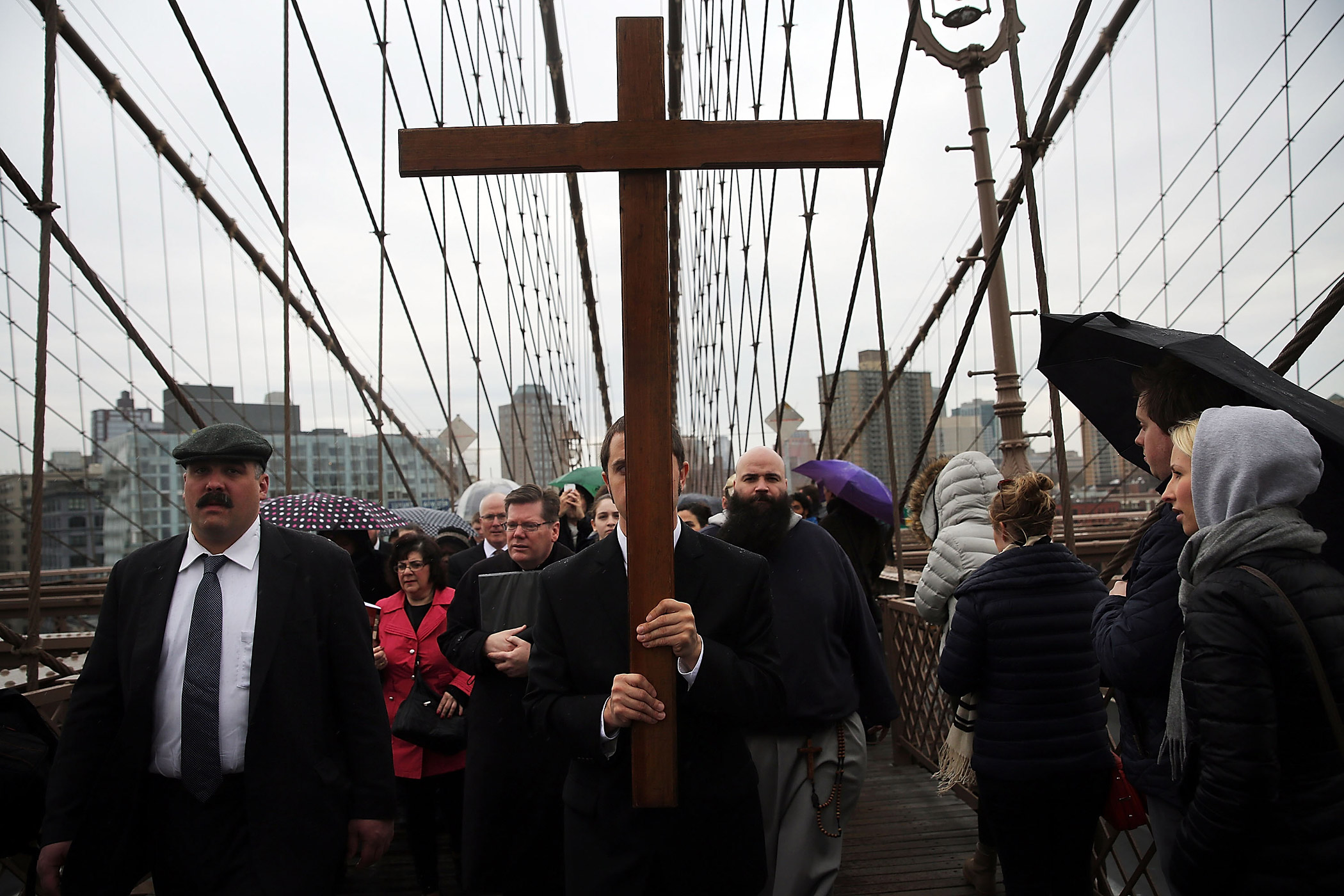 Members of the Archdiocese of New York and the Diocese of Brooklyn lead the Way of the Cross procession over the Brooklyn Bridge on April 3, 2015 in New York City. (Spencer Platt—Getty Images)