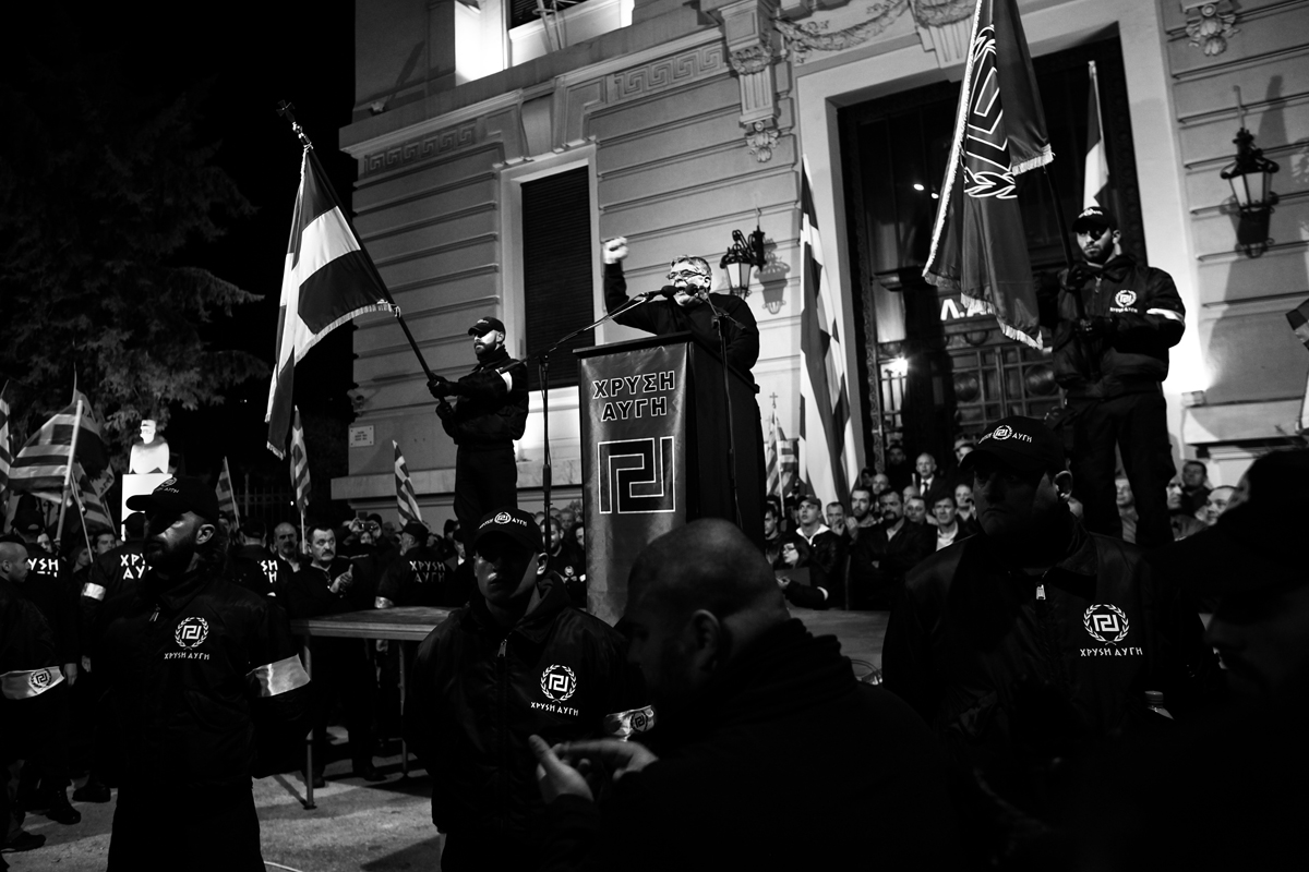 Golden Dawn leader Nikolaos Michaloliakos delivers a speech to party supporters during a rally. Michaloliakos is now imprisoned.