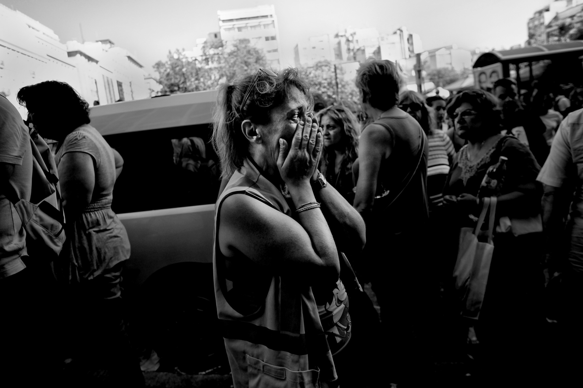 A woman cries during a demonstration of municipal workers in Athens.