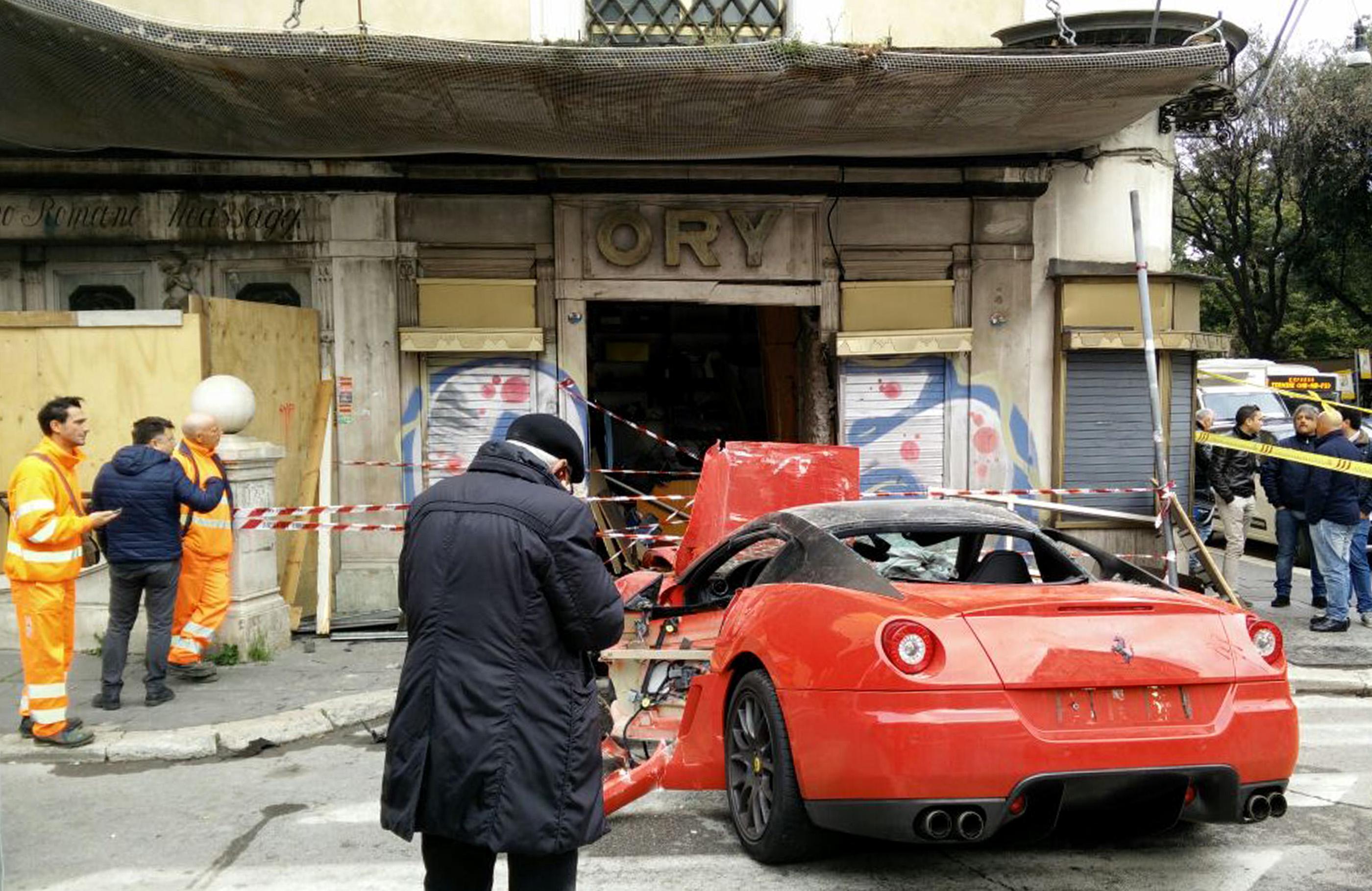 A photograph made available on 01 April 2015 showing the aftermath following a ferrari 599 GTO which crashed into a shop in Viminale's road in Rome, Italy 30 March 2015. (CLAUDIO PERI—EPA)