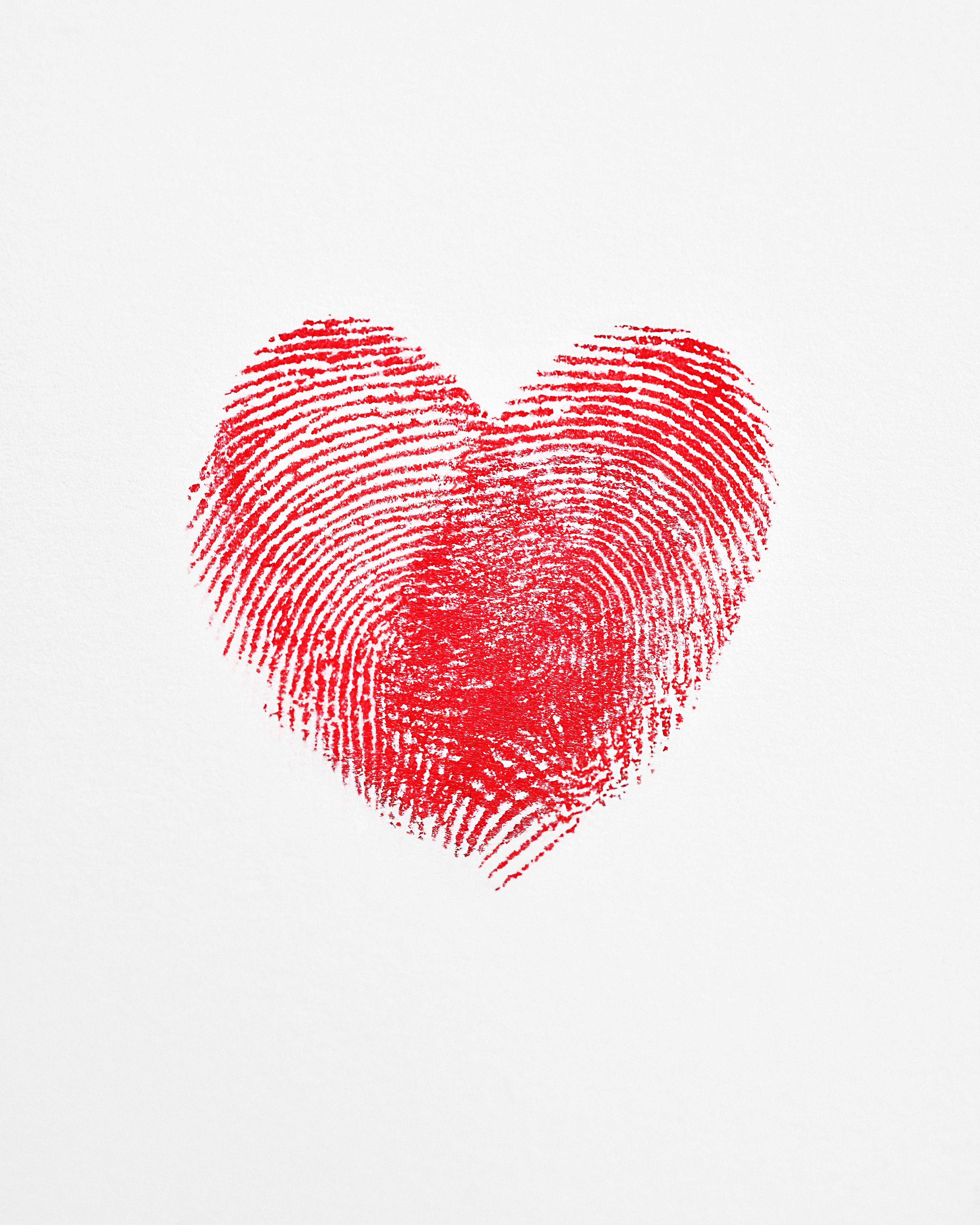 Overlapping fingerprints forming a heart shape