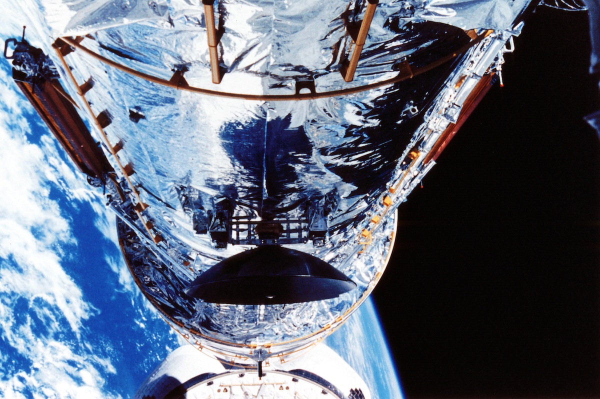 The Hubble Space Telescope orbiting the Earth, c1990s.