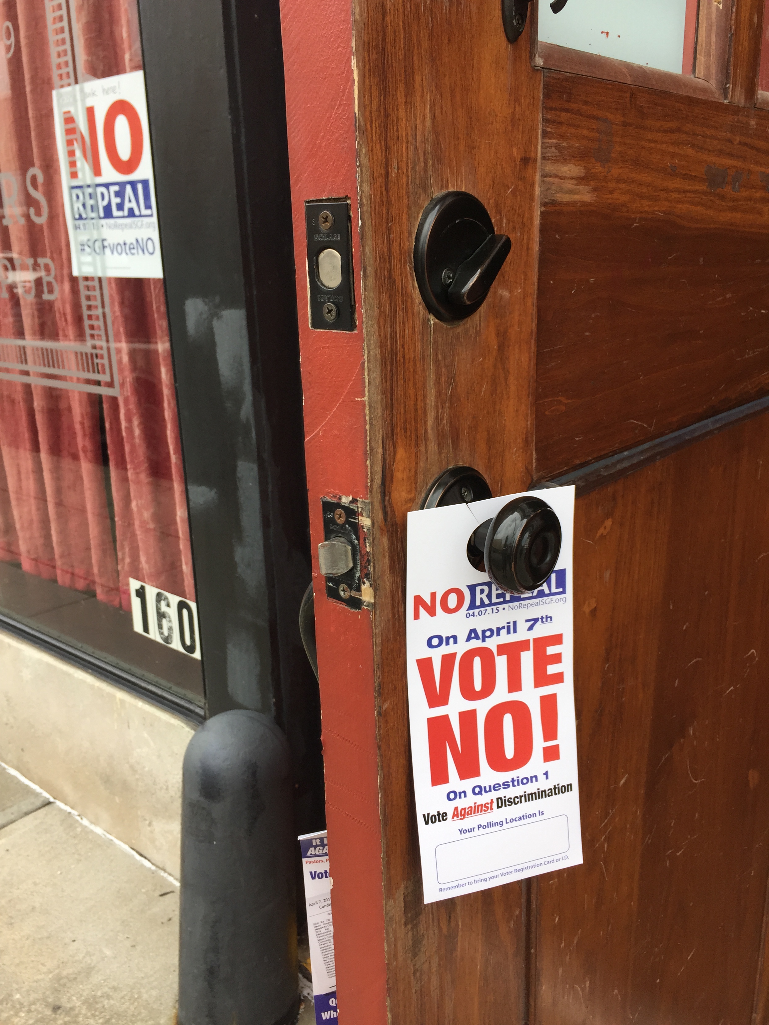 Signs hung at a business in Springfield, Mo., express support for upholding a local non-discrimination measure for LGBT residents, which was repealed on April 7, 2015. (Courtesy of PROMO)