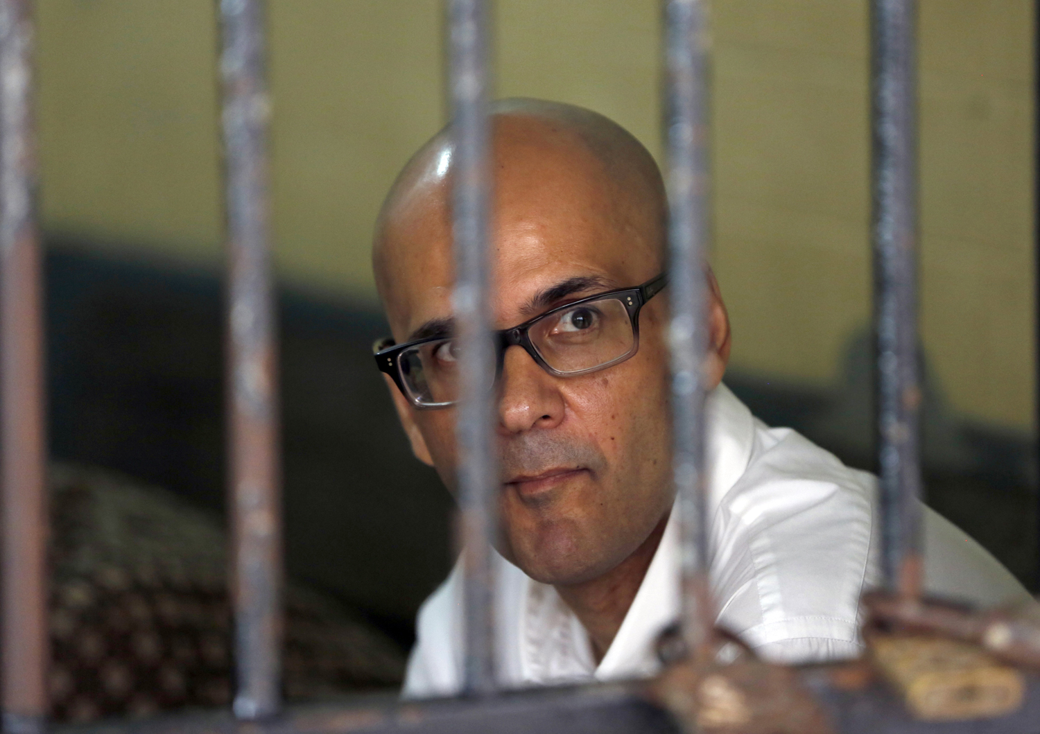 Canadian school administrator Neil Bantleman sits inside a holding cell prior to the start of his trial in Jakarta on March 12, 2015 (Dita Alangkara—AP)