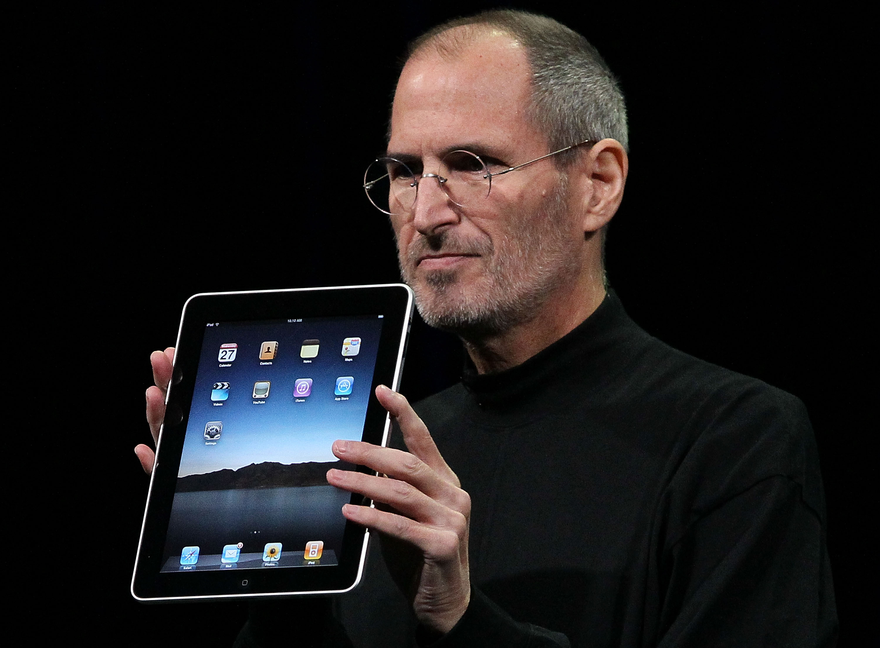 Apple Inc. CEO Steve Jobs holds up the new iPad as he speaks during an Apple Special Event at Yerba Buena Center for the Arts Jan. 27, 2010 in San Francisco, California. (Justin Sullivan&mdash;Getty Images)