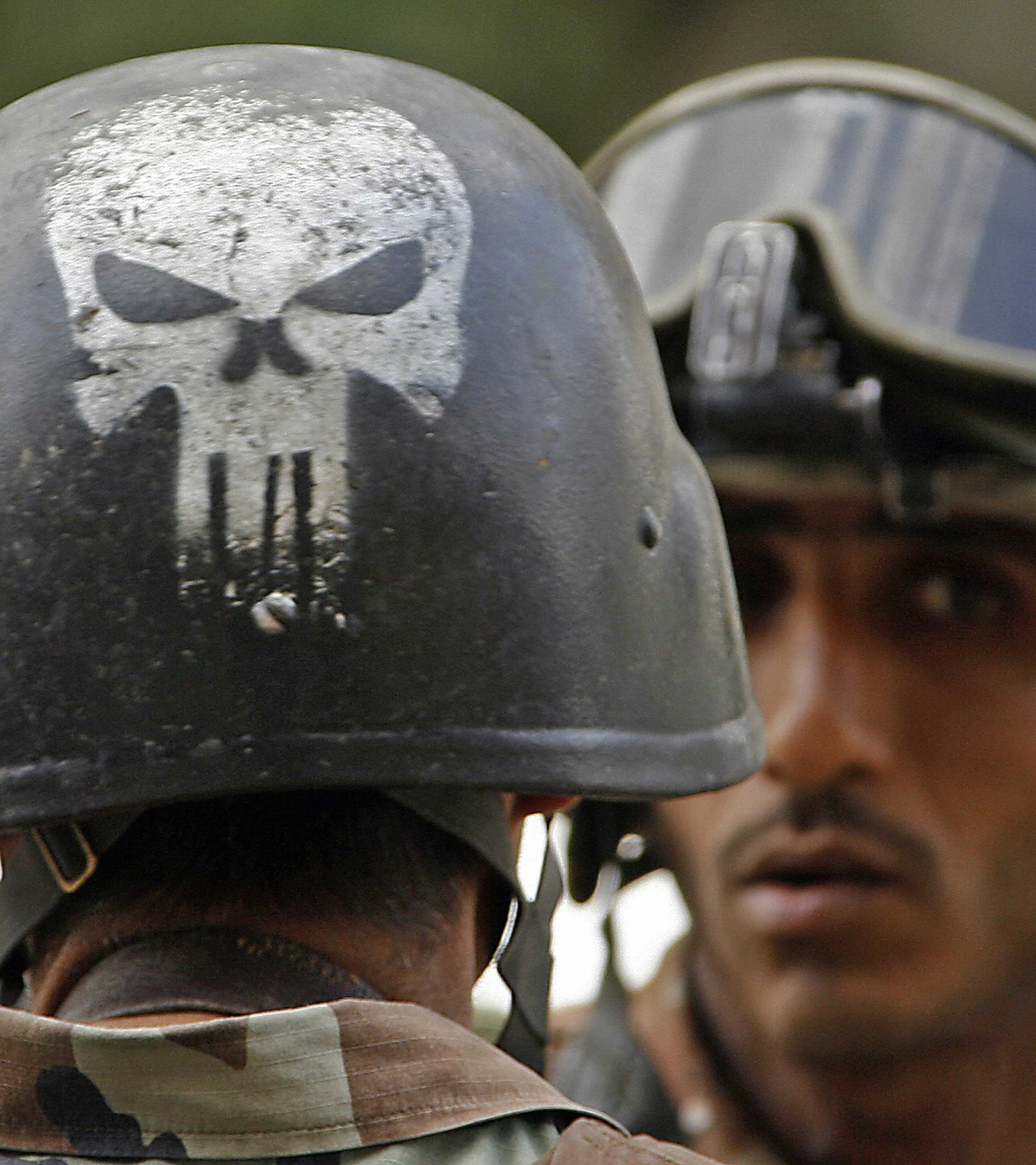 The Punisher skull logo  seen painted on the helmet of an Iraqi army soldier patrolling in Baghdad in 2007. (Patrick Baz—AFP/Getty Images)