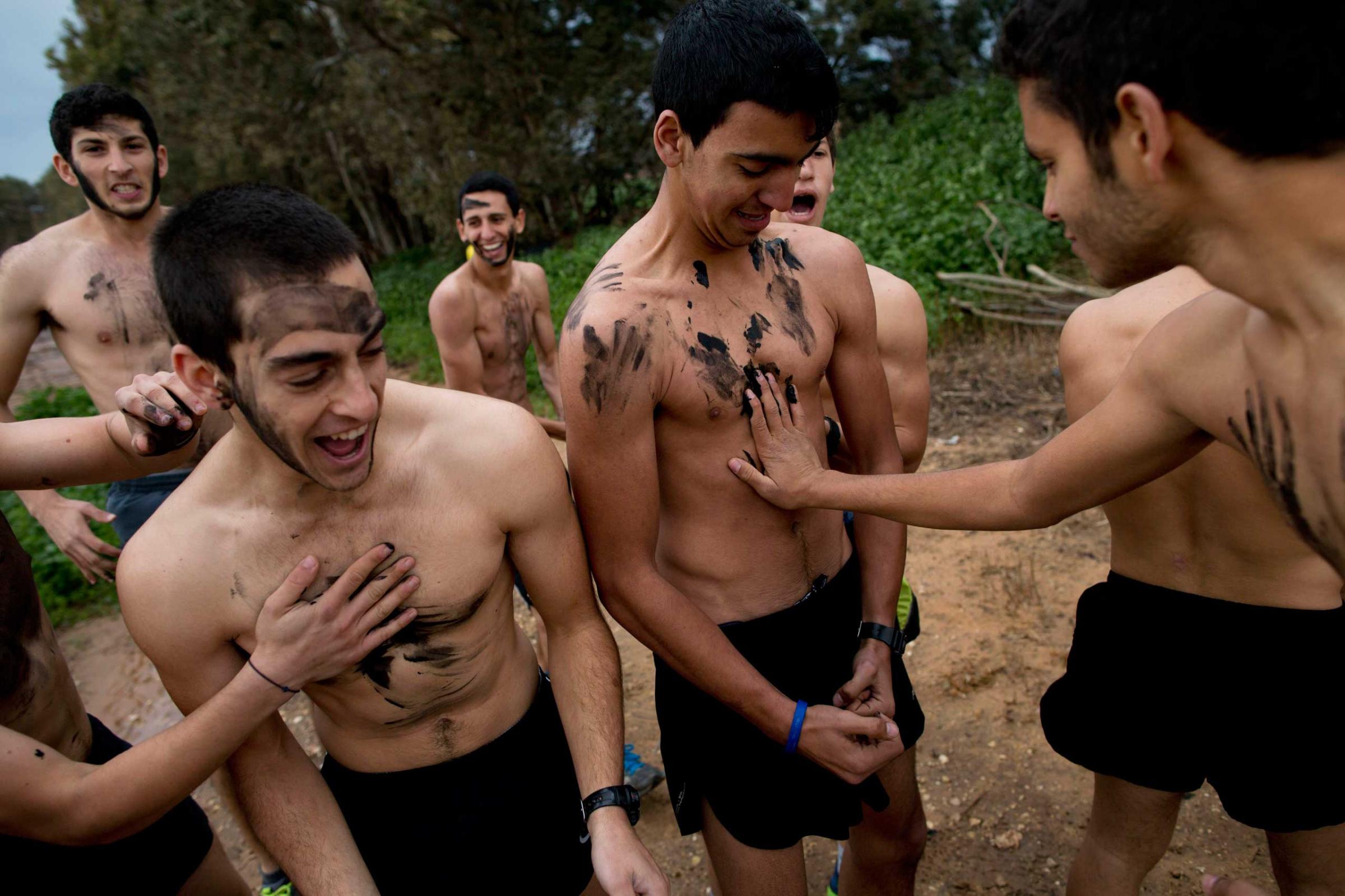 High-school seniors preparing to join the Israeli military later this year take part in a privately run training camp for military combat fitness near Yakum, central Israel, Feb. 13, 2015.