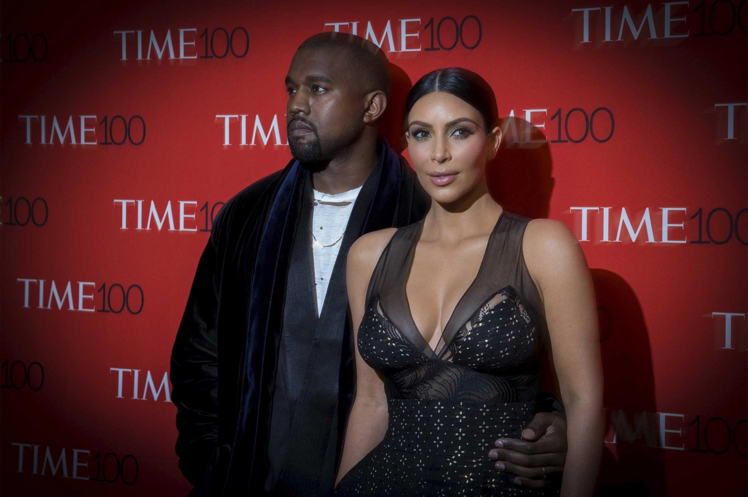 Kanye West and his wife, reality television star Kim Kardashian, arrive for the TIME 100 Gala in New York