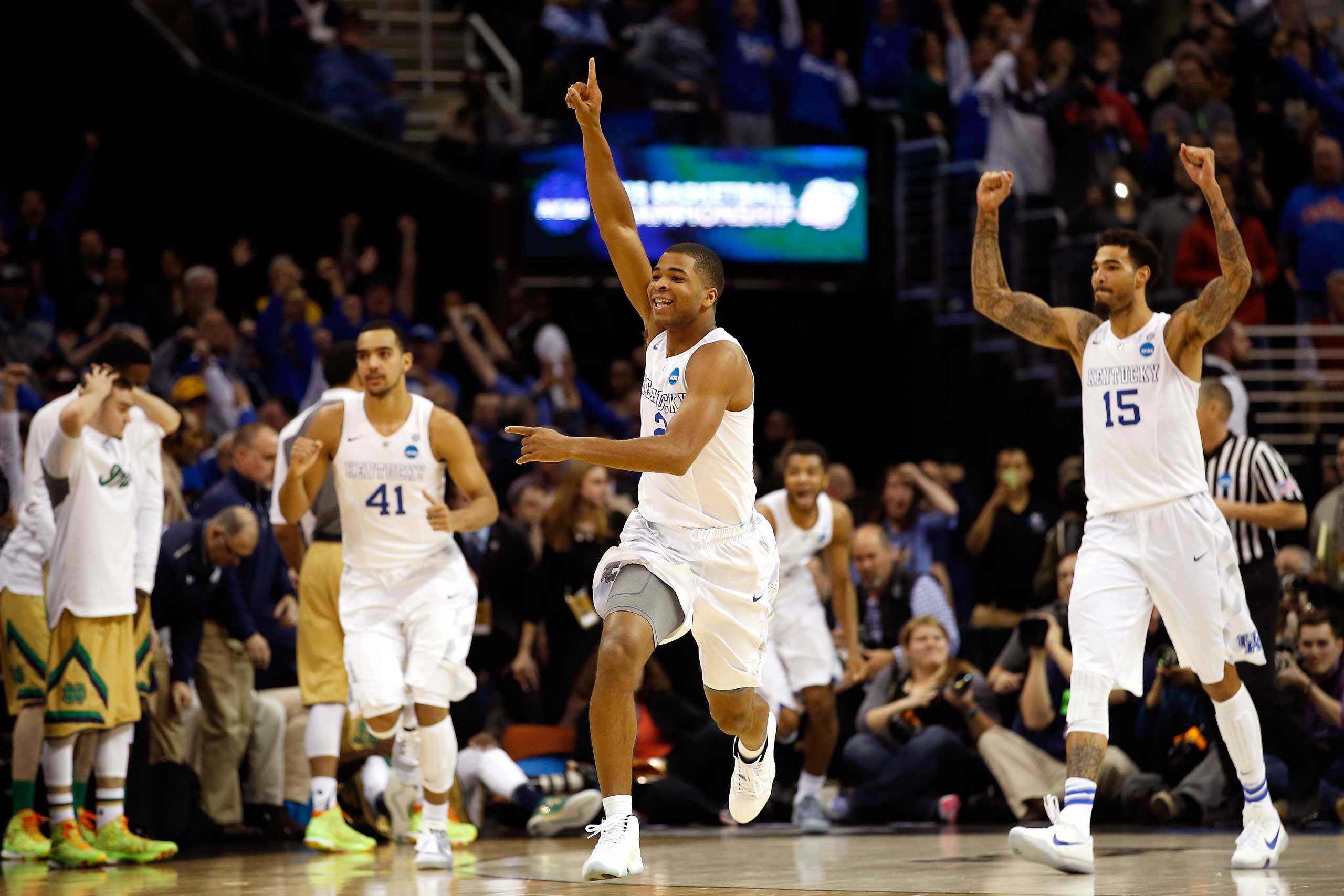 Aaron Harrison of the Kentucky Wildcats celebrates after defeating the Notre Dame Fighting Irish during the Midwest Regional Final of the 2015 NCAA Men's Basketball tournament at Quicken Loans Arena in Cleveland, on Mar. 28, 2015. (Gregory Shamus—Getty Images)