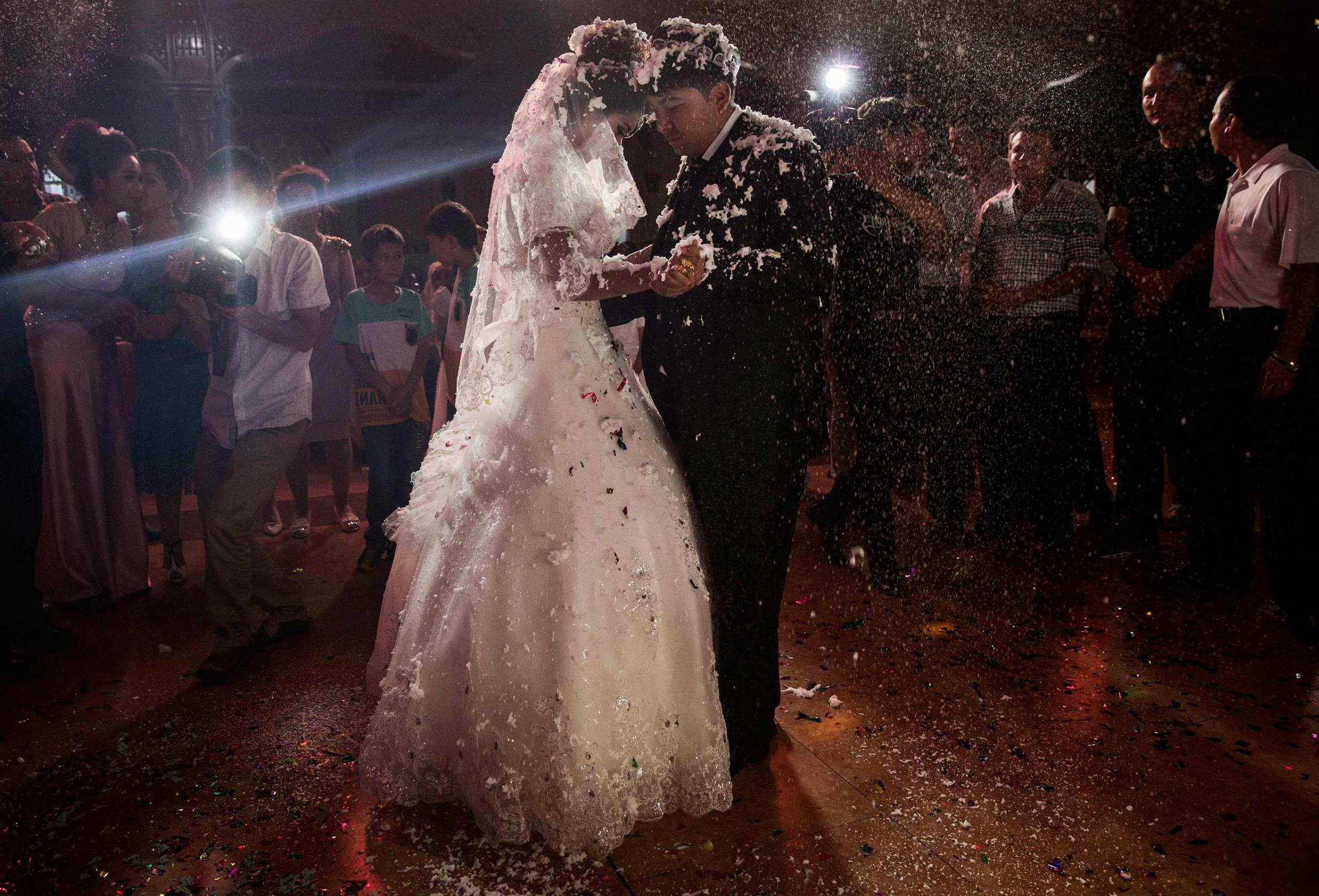 A Uighur couple have their first dance at their wedding celebration after being married in Kashgar, Xinjiang Province, China, on Aug. 2, 2014.