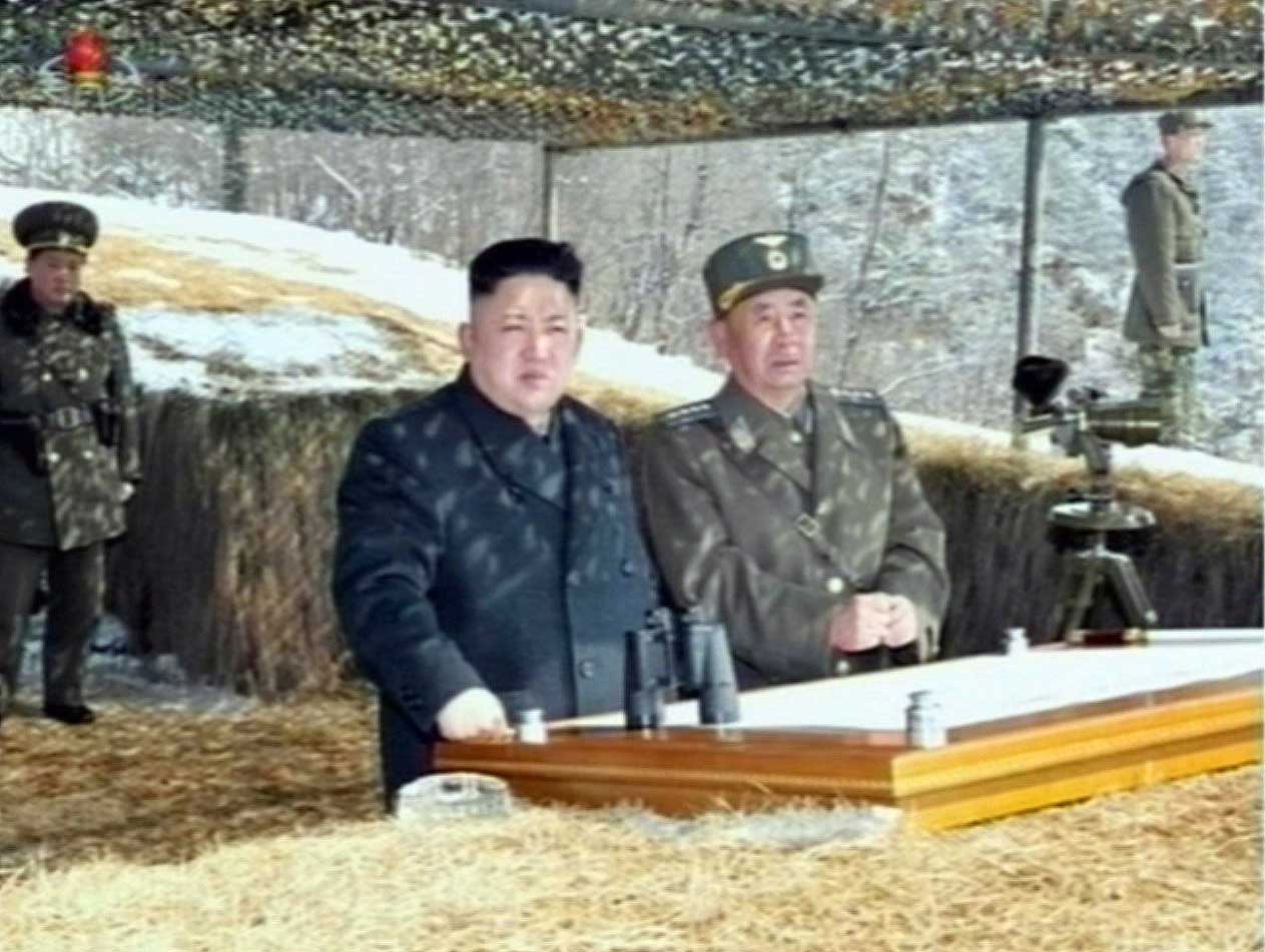 This video grab taken from North Korean TV on March 20, 2013 shows North Korean leader Kim Jong-Un's overseeing a live fire military drill.