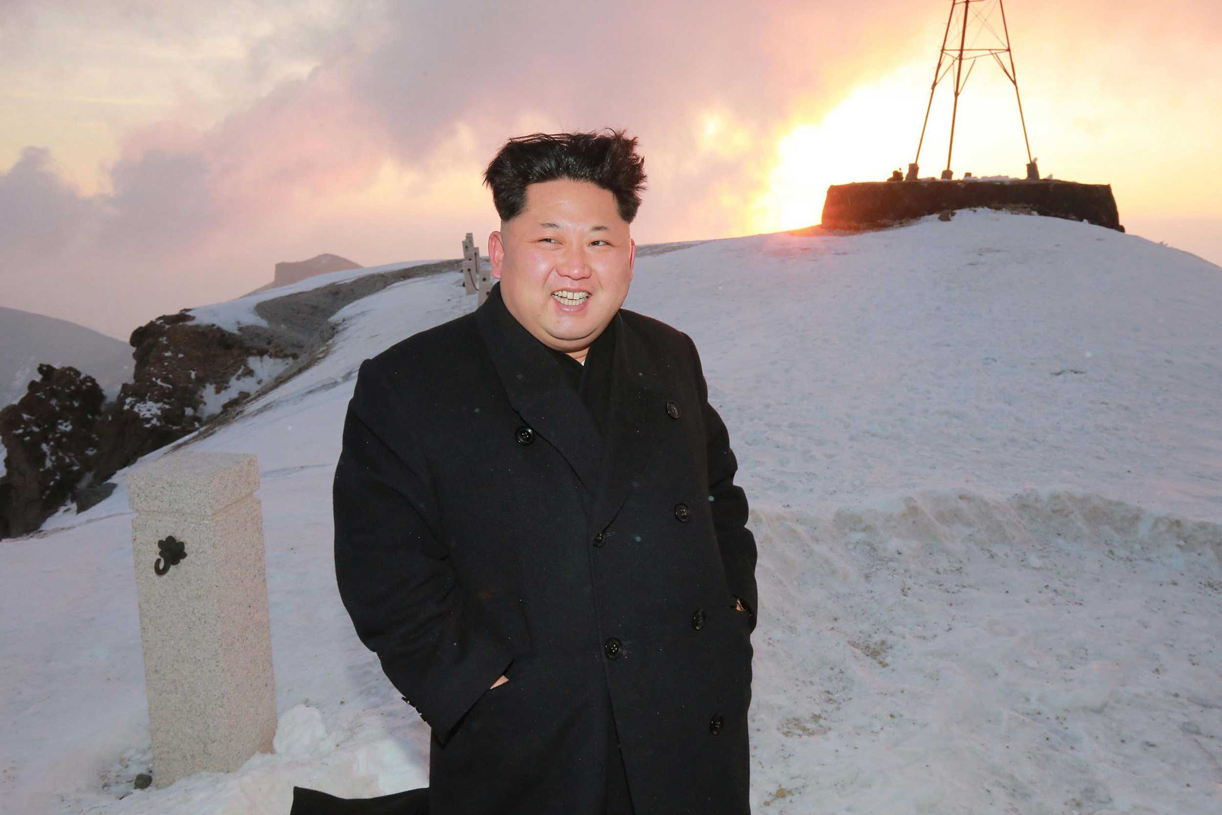 This photo taken on April 18, 2015 and released by North Korea's official Korean Central News Agency (KCNA) on April 20, 2015 shows North Korean leader Kim Jong-Un on a snow-covered Mount Paektu during sunrise in Ryanggang Province. (KNS—AFP/Getty Images)
