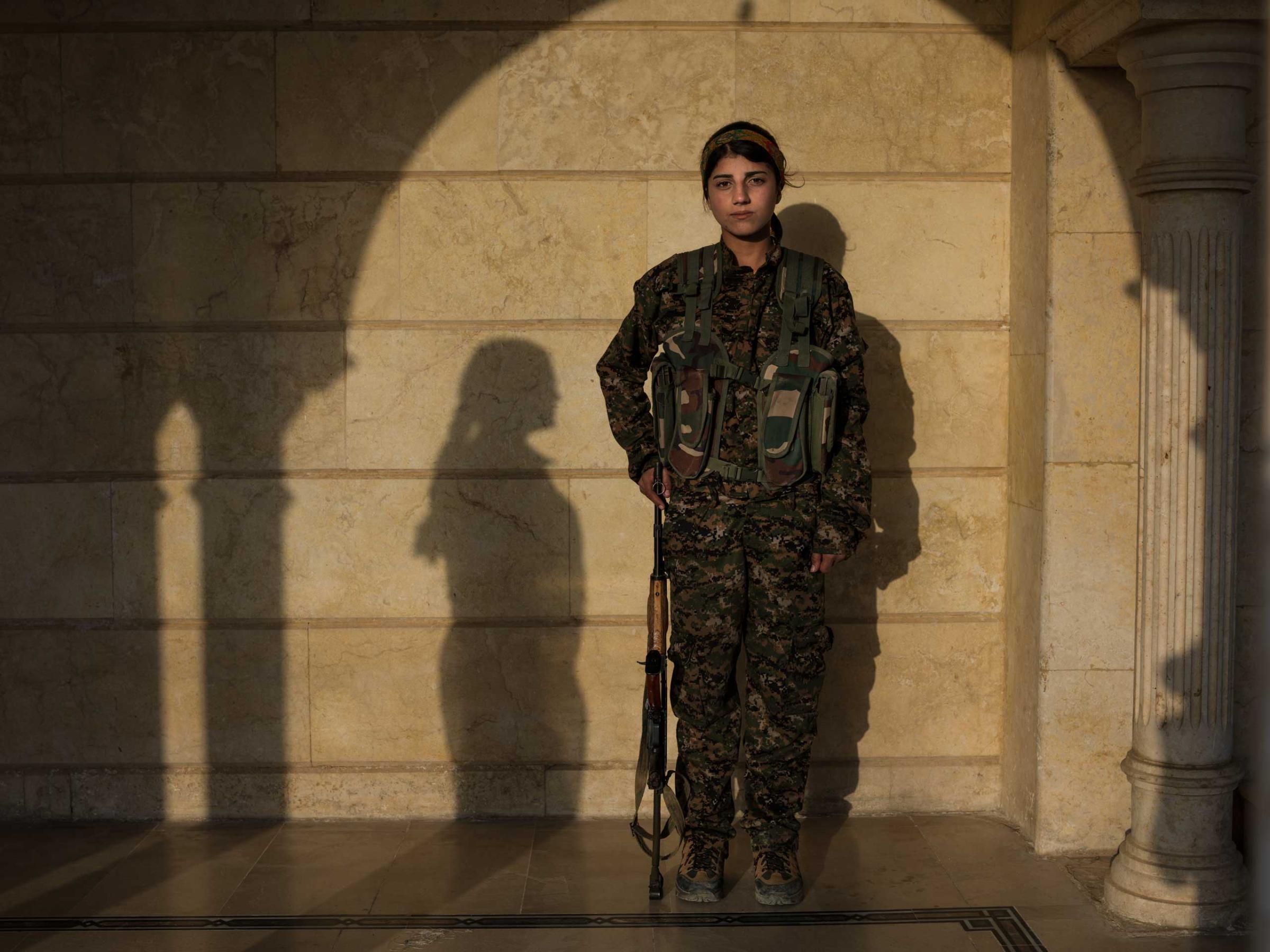 16 year-old YPJ fighter Barkhodan Kochar from Darbasi, Syria. "The war influenced me a lot. Before joining YPJ, whenever I asked my family about politics, they'd say 'that's not your business, you're just a girl'. But when I saw how the women of YPJ gave their lives for what they believed in, I knew that I wanted to be one of them." Newsha Tavakolian for TIME "I joined YPJ in 2014, because I wanted to defend my homeland. The war influenced me a lot. Before joining YPJ, whenever I asked my family about politics, they'd say 'that's not your business, you're just a girl'. But when I saw how the women of YPJ gave their lives for what they believed in, I knew that I wanted to be one of them. I feel much more empowered as a woman now. As a 16-year-old girl, I think that I have a very important role in my country and I will keep on fighting until the last drop of my blood is shed."