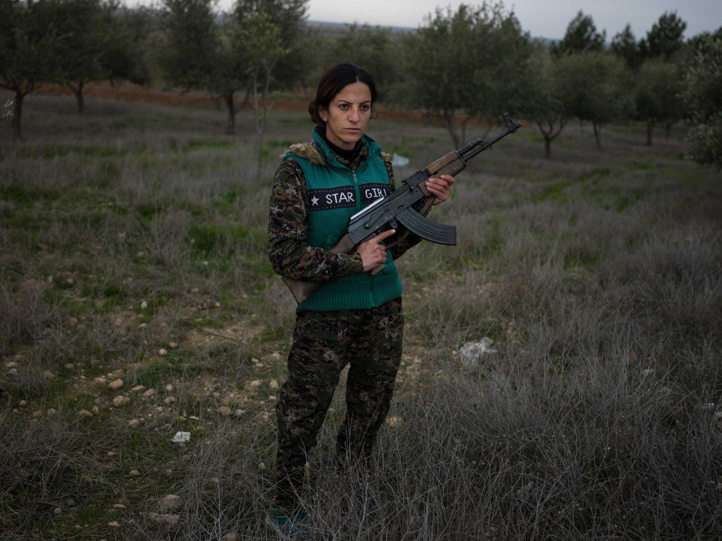 18 year-old YPJ fighter Saria Zilan from Amuda, Syria:"I fought with ISIS in Serikani. I captured one of them and wanted to kill him, but my comrades did not let me. He kept staring at the ground and would not look at me, because he said it was forbidden by his religion to look at a woman." Newsha Tavakolian for TIME "It's been one year and four months since I joined YPJ. When I saw Martyr Deli on TV after ISIS beheaded her, I went to her burial ceremony the next day in Amuda. I saw Deli's mother sobbing madly. Right there I swore to myself to avenge her death. I joined YPJ the day after. In the past, women had various roles in the society. but all those roles were taken from them. We are here now to take back the role of women in society. I grew up in a country, where I was not allowed to speak my mother tongue of Kurdish. I was not allowed to have a Kurdish name. If you were a pro-Kurdish activist, they'd arrest you and put you in jail. But since the Rojava revolution, we have been getting back our rights. We were not allowed to speak our language before, and now ISIS wants to wipe us off completely from the Earth. I fought with ISIS in Serikani. I captured one of them and wanted to kill him, but my comrades did not let me do so. He kept staring at the ground and would not look at me, because he said it was forbidden by his religion to look at a woman. I have changed a lot. My way of thinking about the world has changed since I joined YPJ. Maybe some people wonder why we're doing this. But when they get to know us better, they will understand why. We are emotional people."