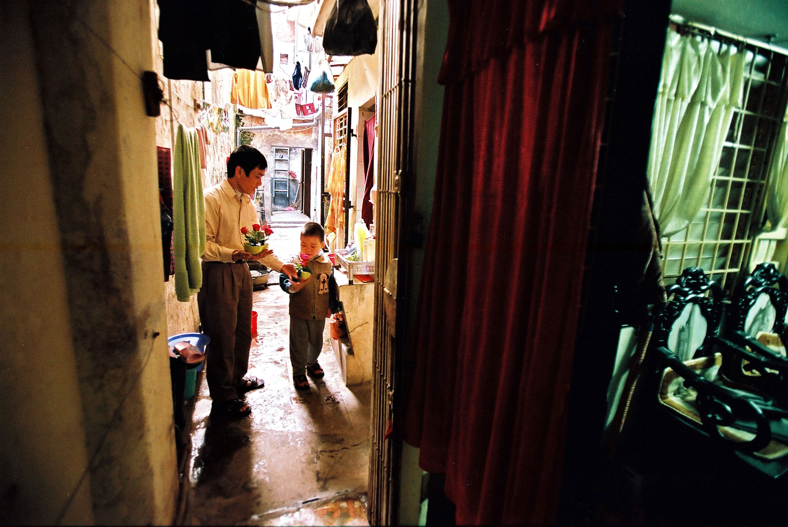 A father and his son arrange flowers together in Hanoi, March 17, 2009.
