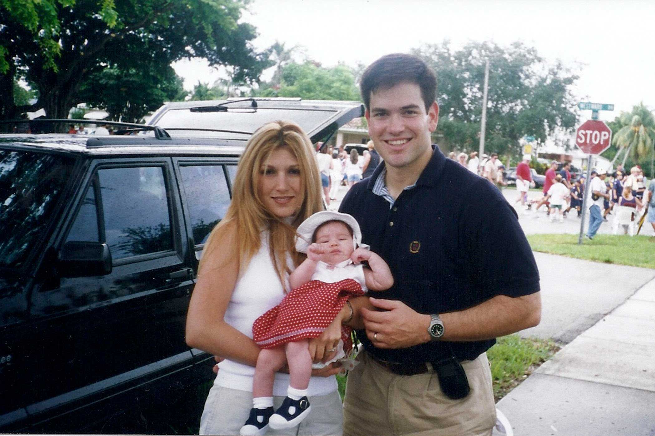 Jeanette Rubio and Marco Rubio holding their youngest child Amanda Rubio in 2000.