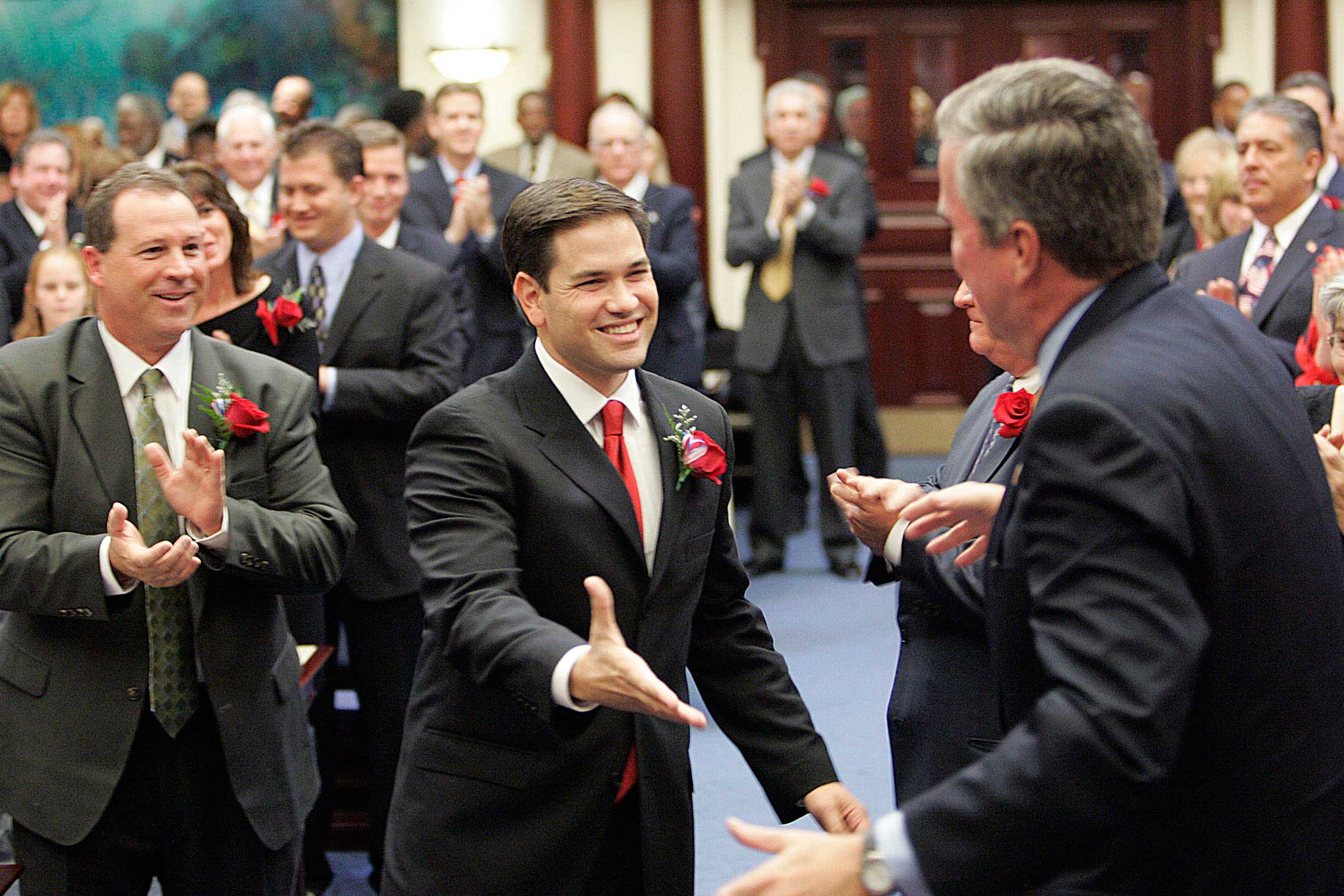 Marco Rubio greets Florida Gov. Jeb Bush, on his way to being sworn in as the new speaker of the Florida House on Nov. 21, 2006, in Tallahassee, Fla.