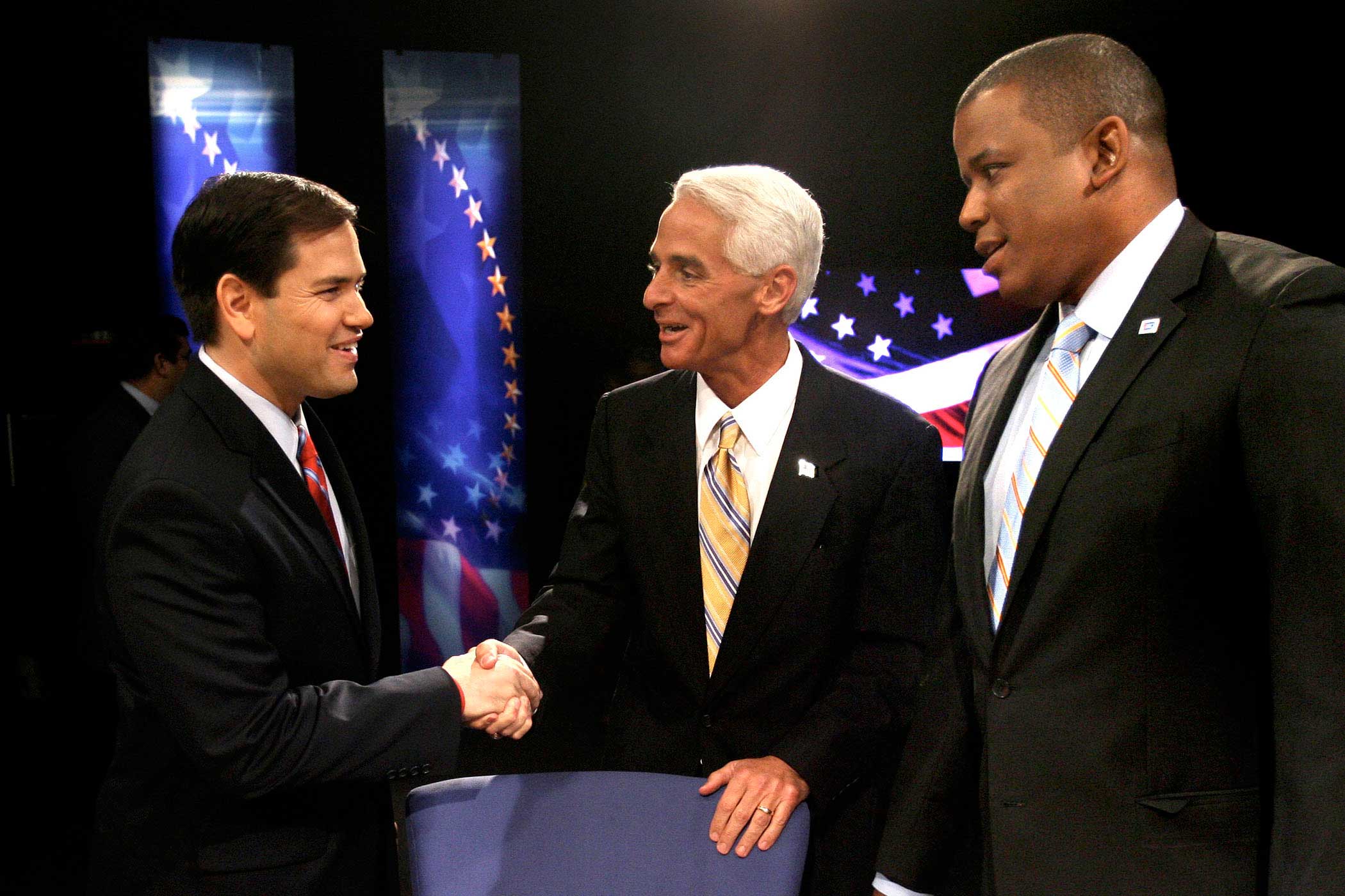From left, Marco Rubio, Charlie Crist and Kendrick Meek greet each other before the start of their debate at the studios of WESH-TV in Winter Park, Fla., on Oct. 26, 2010.