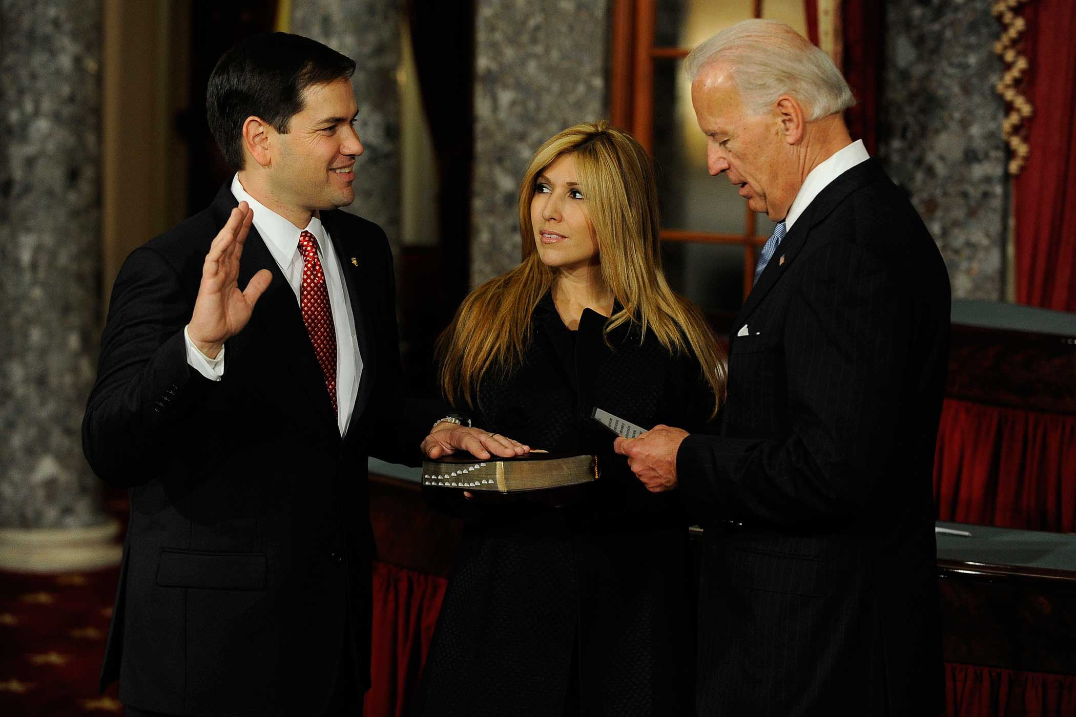 Vice President Joe Biden swears in Senator Marco Rubio to the U.S. Senate, on Jan. 5, 2010, in Washington, D.C. as his wife, Jeanette Rubio looks on.