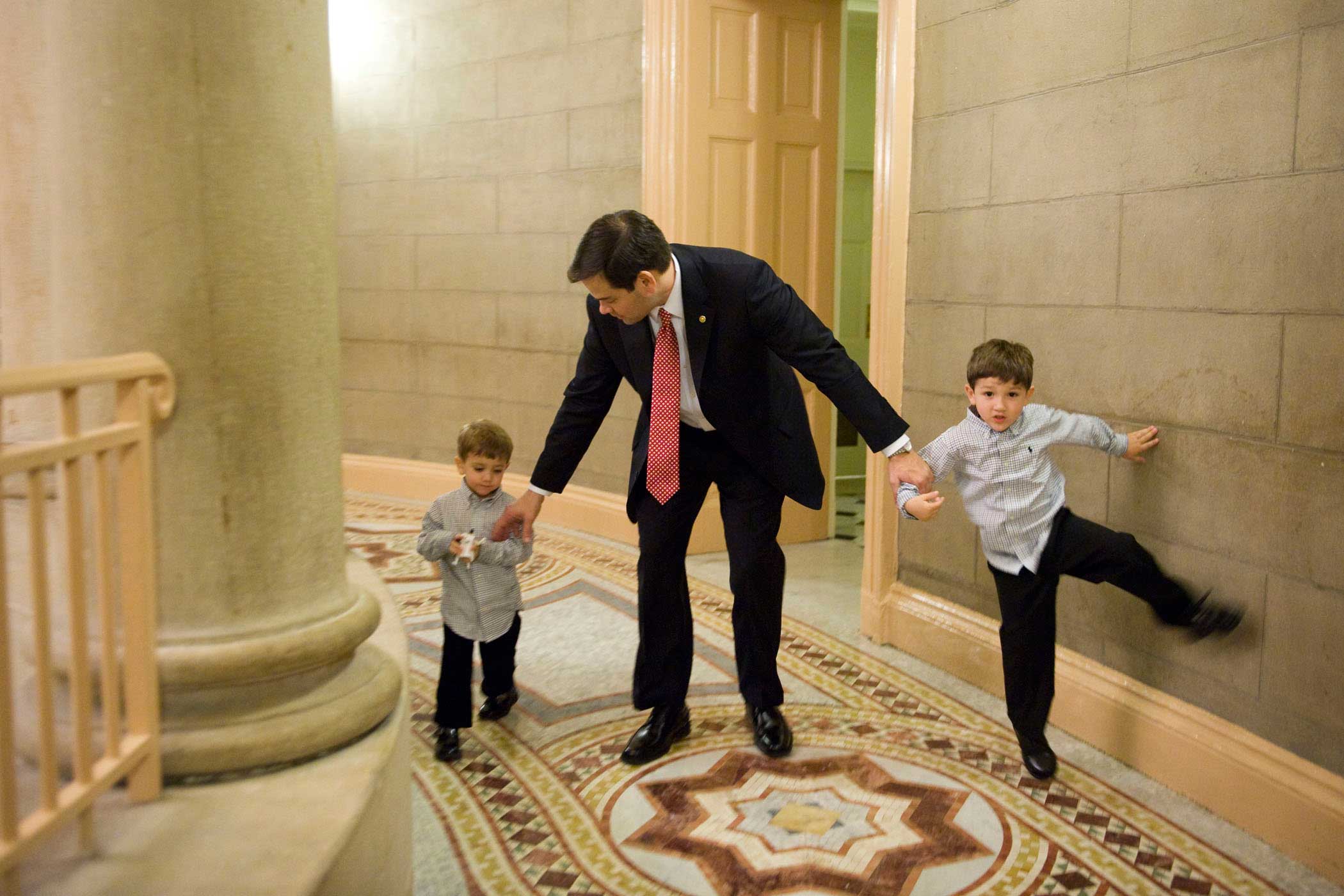 Marco Rubio and his sons Anthony, 5, right, and Dominic, 3, make their way to a swearing in ceremony for the 112th Congress in the Old Senate Chamber on Jan. 5, 2011.