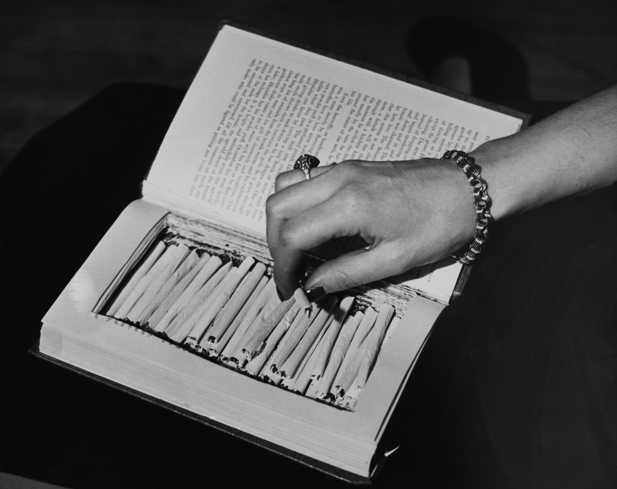 Marijuana reefers hidden In a book, circa 1940 (Keystone / Getty Images)