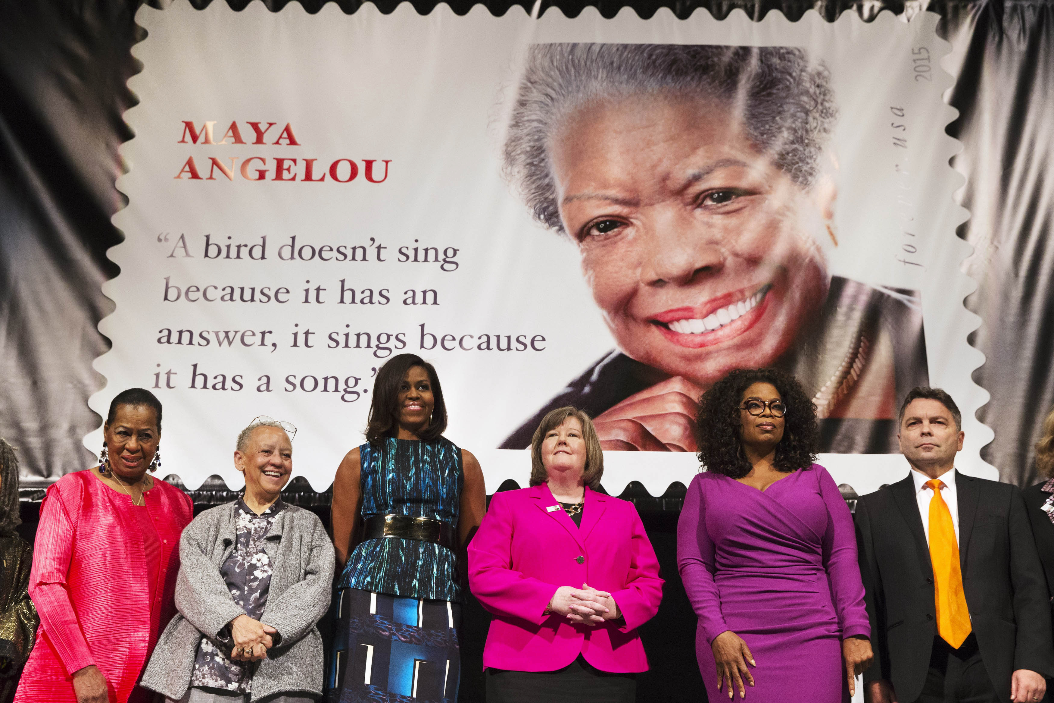 First lady Michelle Obama participates in the unveiling of the Maya Angelou Forever Stamp, Tuesday, April 7, 2015, at the Warner Theater in Washington D.C.