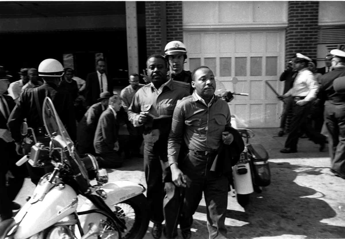 Rev. Ralph Abernathy, left, and Rev. Martin Luther King Jr., right are taken by a policeman as they led a line of demonstrators into the business section of Birmingham, Ala., on April 12, 1963. This is the photograph that ran with TIME's original coverage of their arrests. (AP Photo)