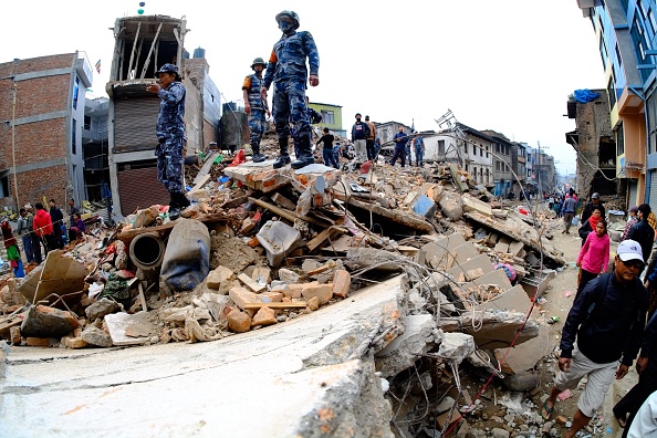 Search and rescue team work among the debris of houses after a powerful earthquake hits Katmandu, Nepal on April 26, 2015. (Sunil Pradhan—Anadolu Agency/Getty Images)