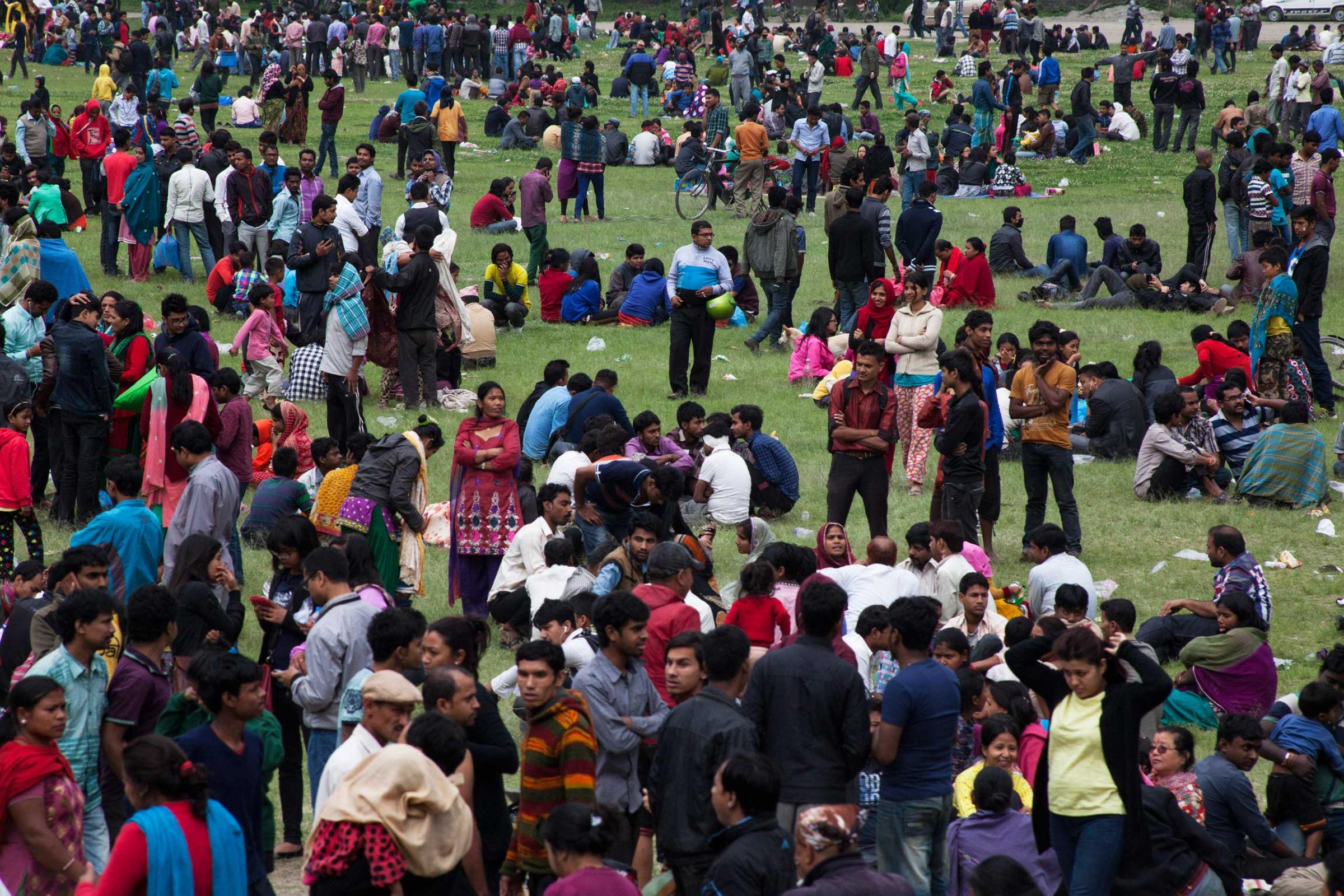 People staying outdoors in fear of aftershocks, in central Kathmandu.