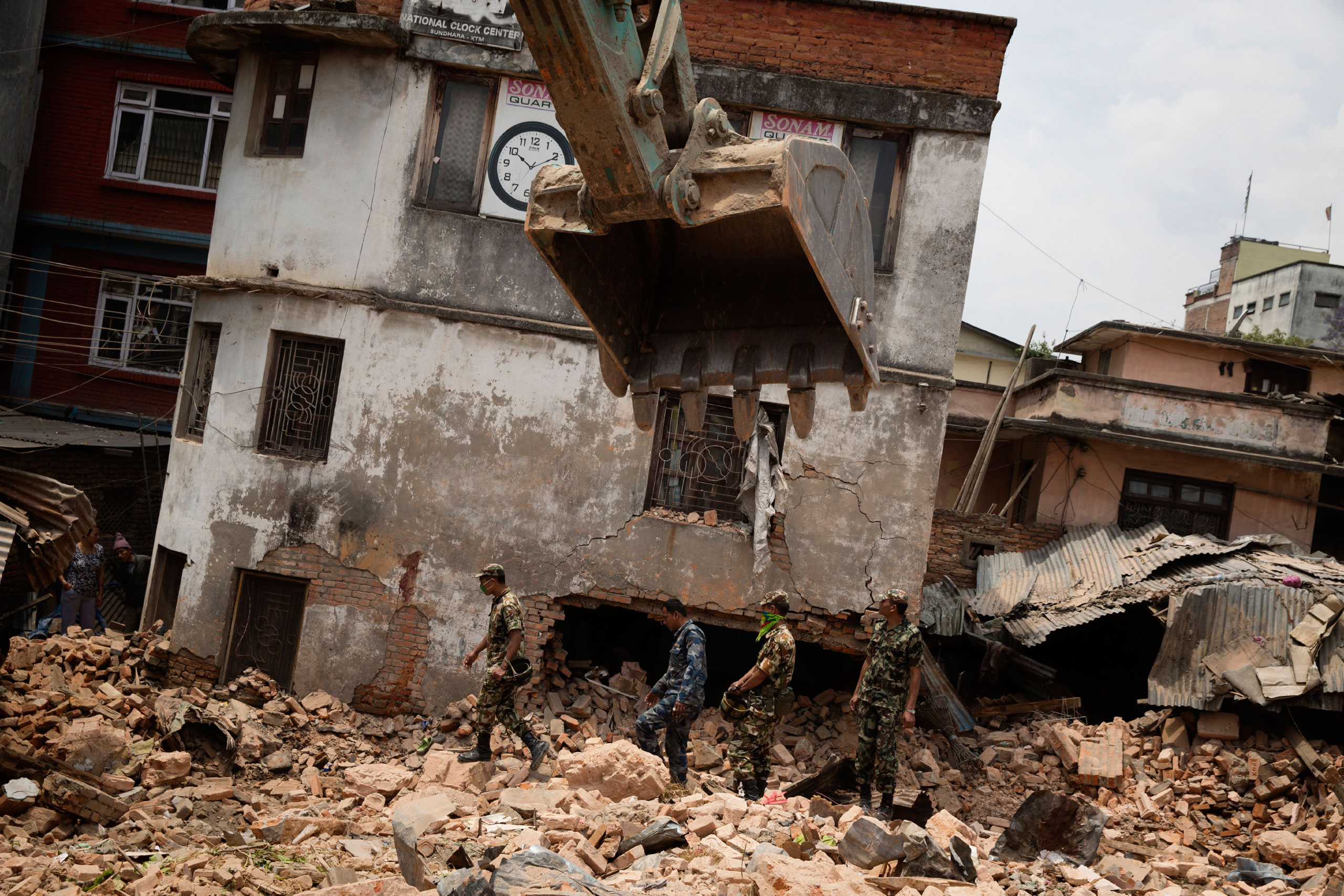 Nepalese forces excavate the Dharahara tower in Kathmandu, April. 26, 2015.