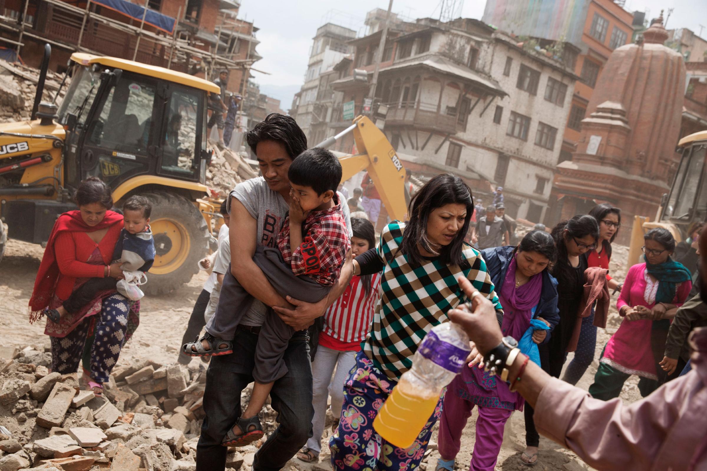 Nepali people flee buildings during an aftershock in Kathmandu, Nepal on April. 27, 2015. Nepal had a severe earthquake on April 25th. Photo by Adam Ferguson for Time