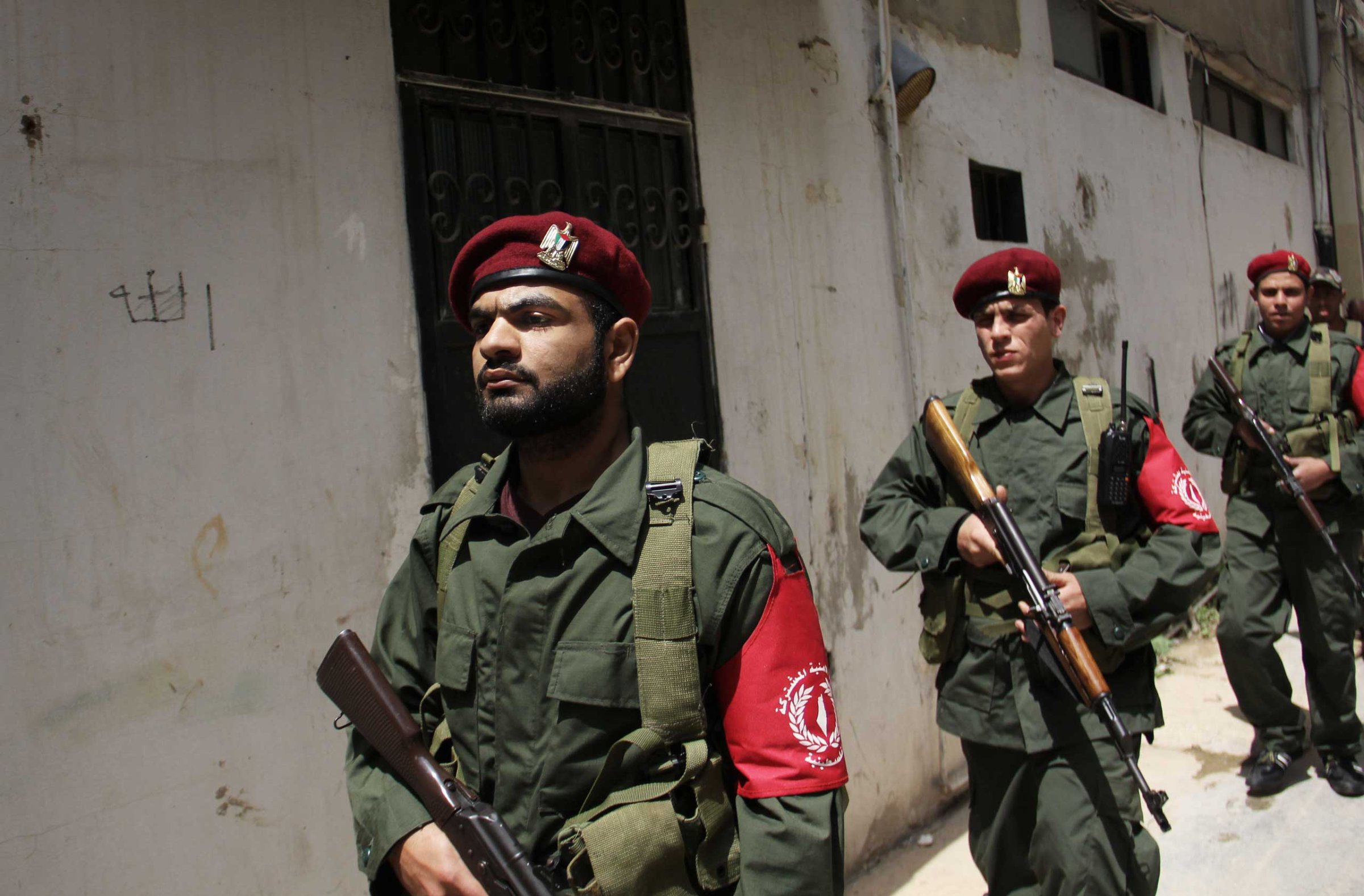 Members of a new Palestinian joint force patrol in Palestinian refugee camp Ain el-Helweh, in Lebanon on April 19, 2015.