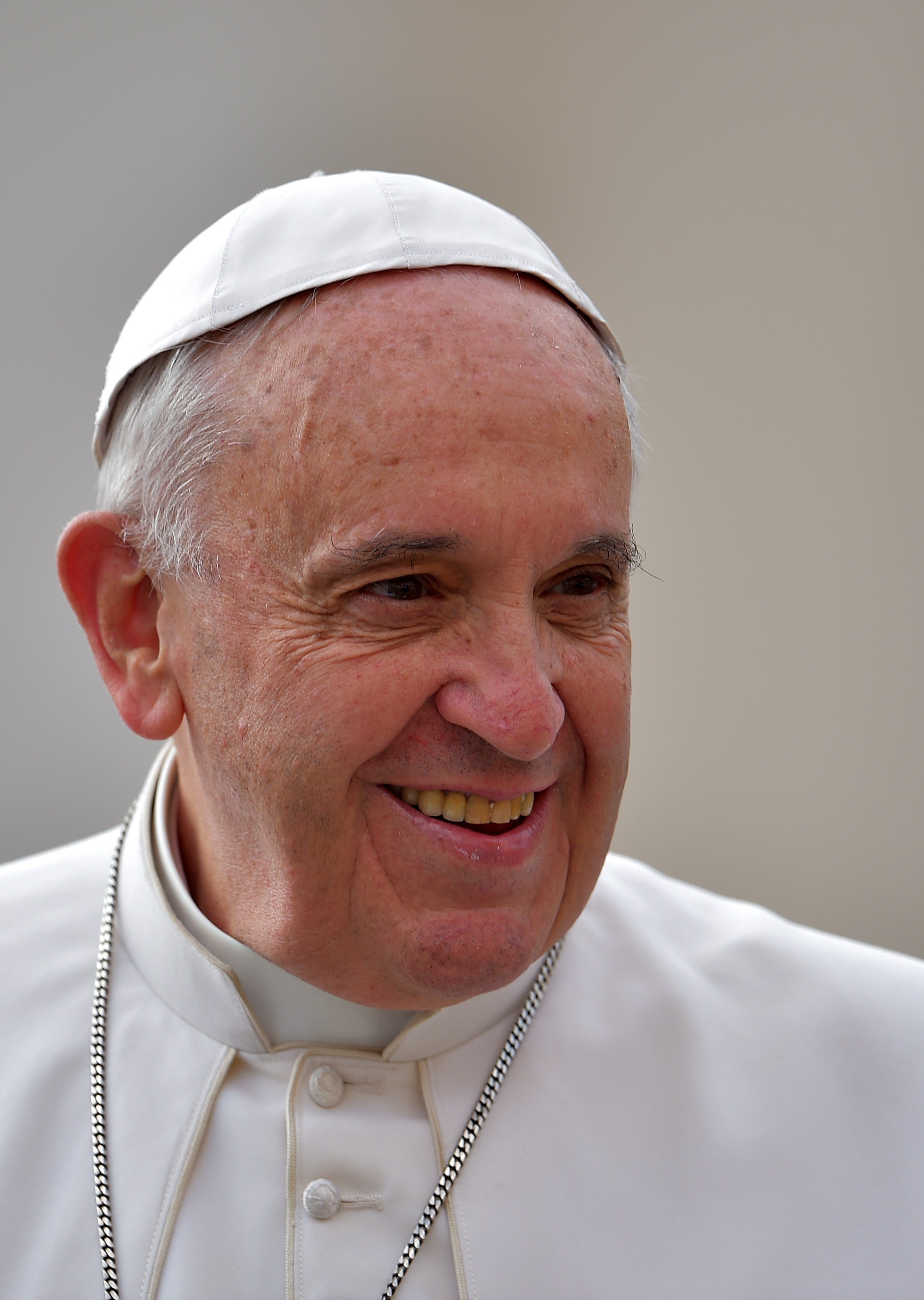 Pope Francis smiles as he arrives to lead his open-air weekly audience in St. Peter's square on April 29, 2015 at the Vatican. (Vincenzo Pinto—AFP/Getty Images)