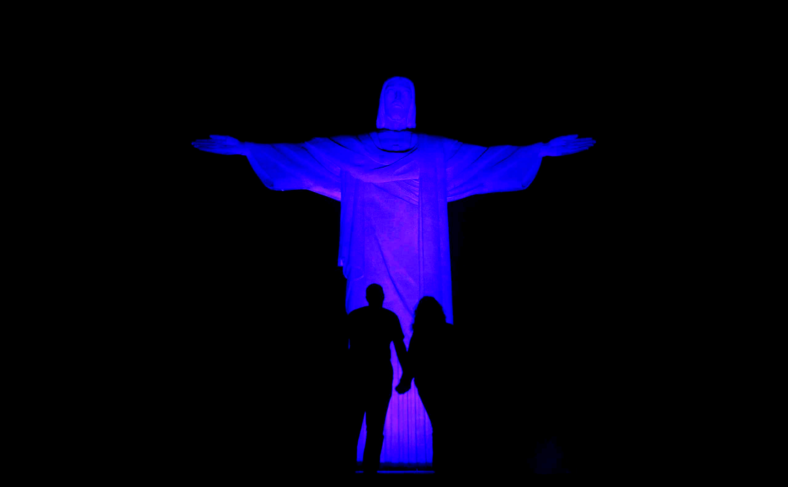 The statue of Christ the Redeemer is lit up in blue for the "Light It Up Blue" campaign to mark the World Autism Awareness Day in Rio de Janeiro April 1, 2015. (Pilar Olivares—Reuters)