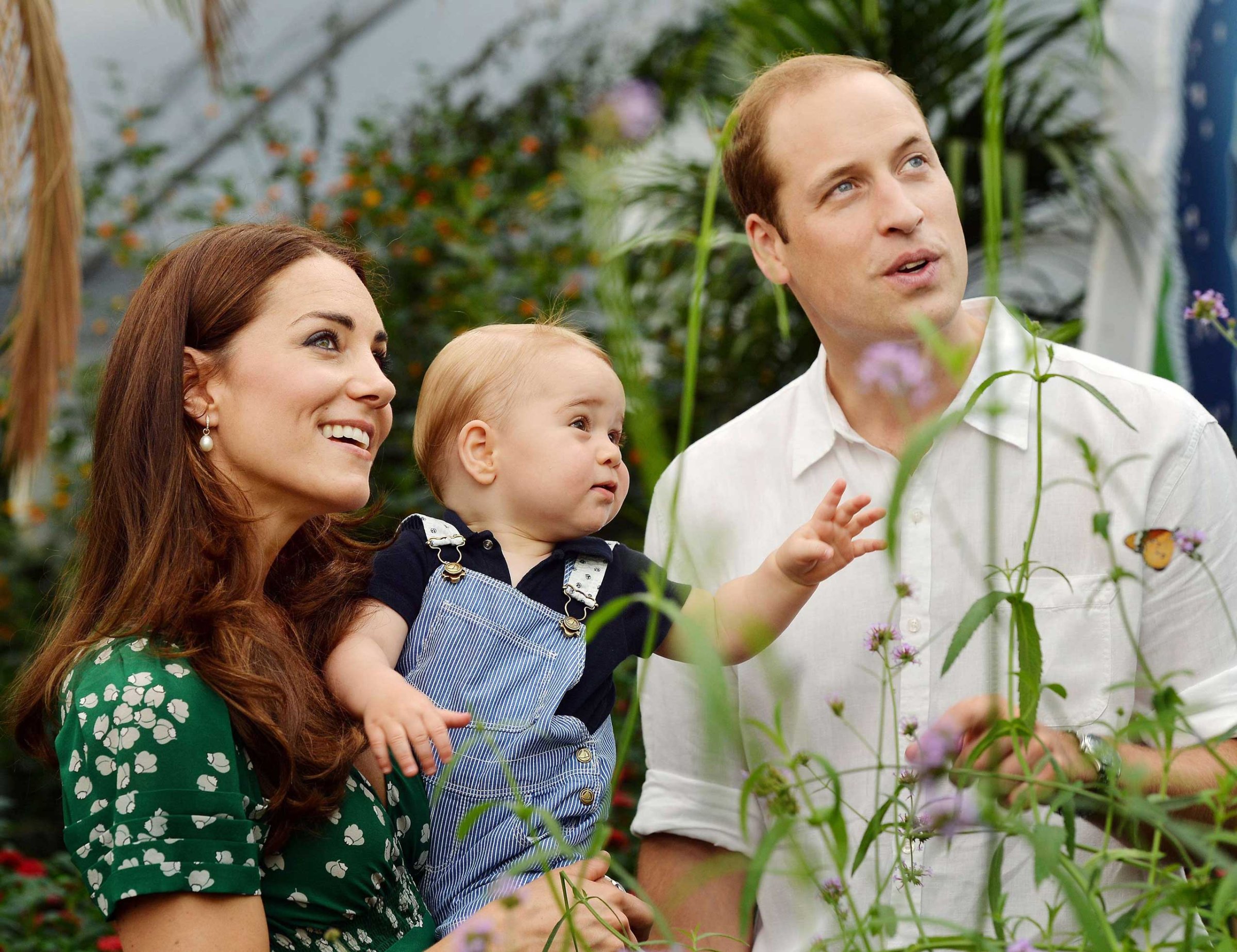 Prince William (L) and Catherine, Duchess of Cambridge with Prince George during a visit to the Sensational Butterflies exhibition at the Natural History Museum in London on July 2, 2014.