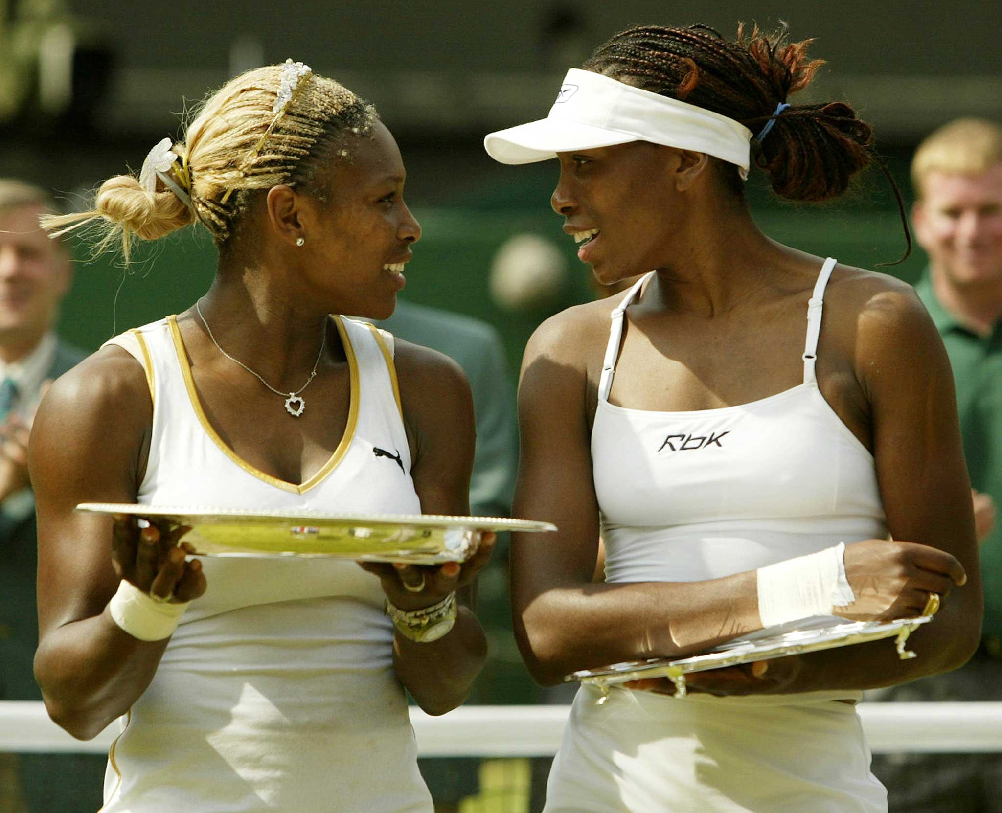 SERENA AND VENUS WILLIAMS OF THE U.S. HOLD THEIR TROPHIES AT WIMBLEDON.