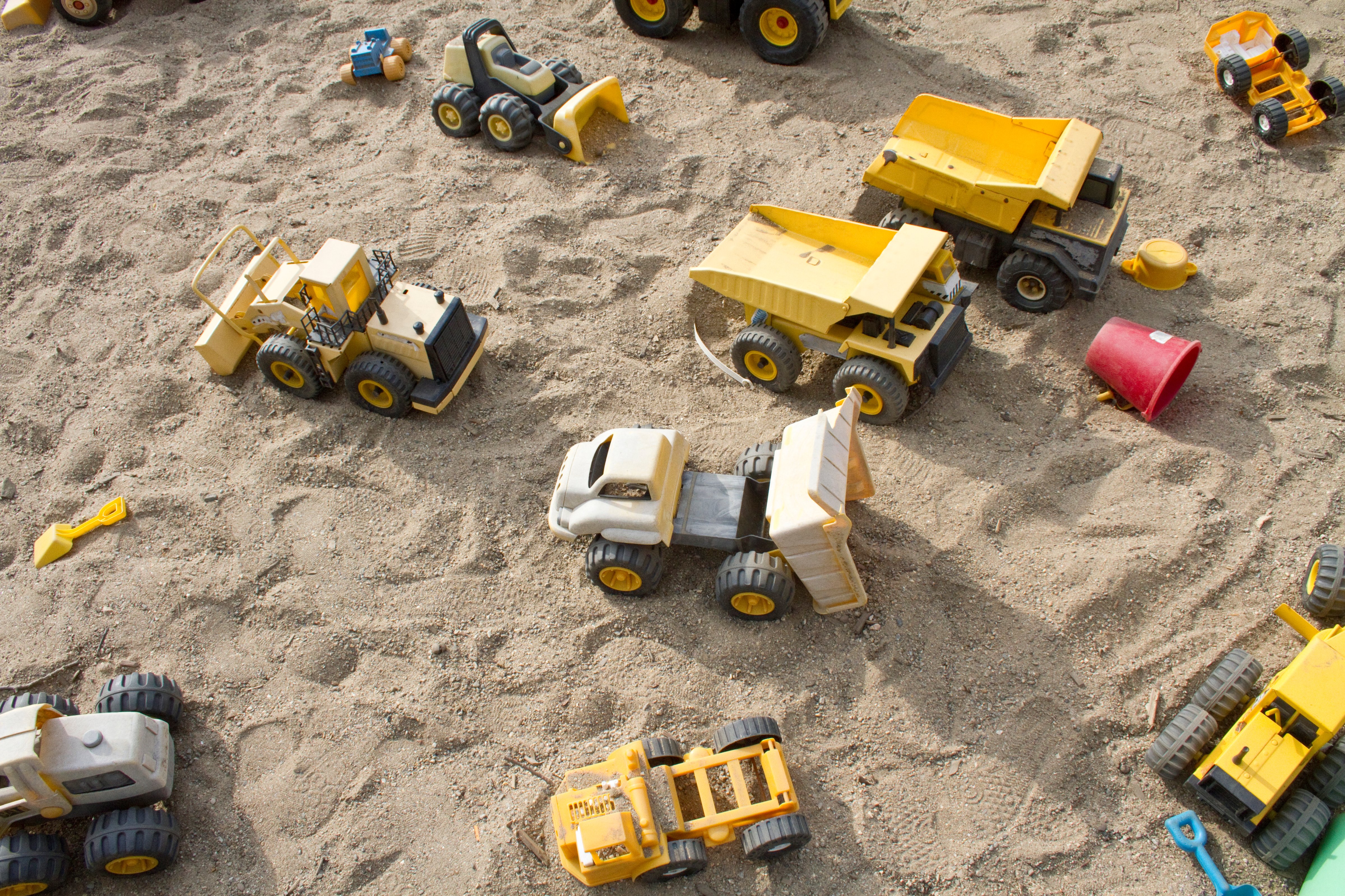 Toy trucks in a sandbox