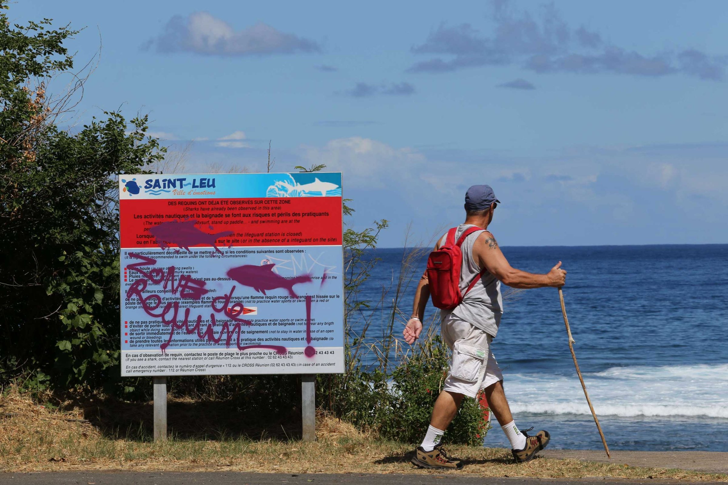 A graffiti reading "Shark's area" has been written on an information board, on April 14, 2015 off Saint-Leu, on the western coast of the French Indian Ocean island of La Reunion, two days after a 13-year-old Elio Canestri was attacked and killed by a shark.