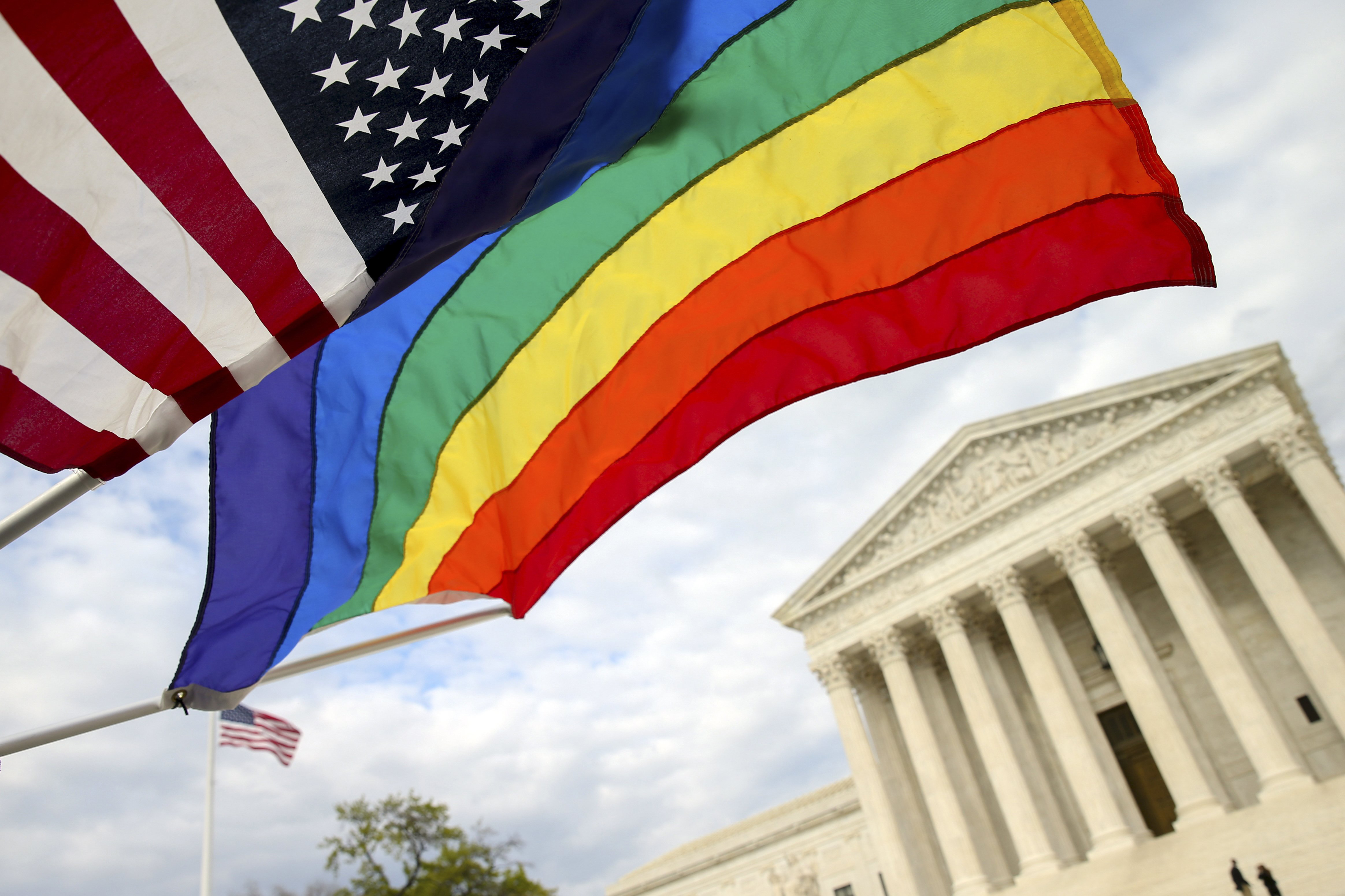 An American flag and a rainbow colored flag flies in front of the Supreme Court in Washington, April 27, 2015, as the Supreme Court is scheduled to hear arguments on the constitutionality of state bans on same-sex marriage on Tuesday. (Andrew Harnik—AP)