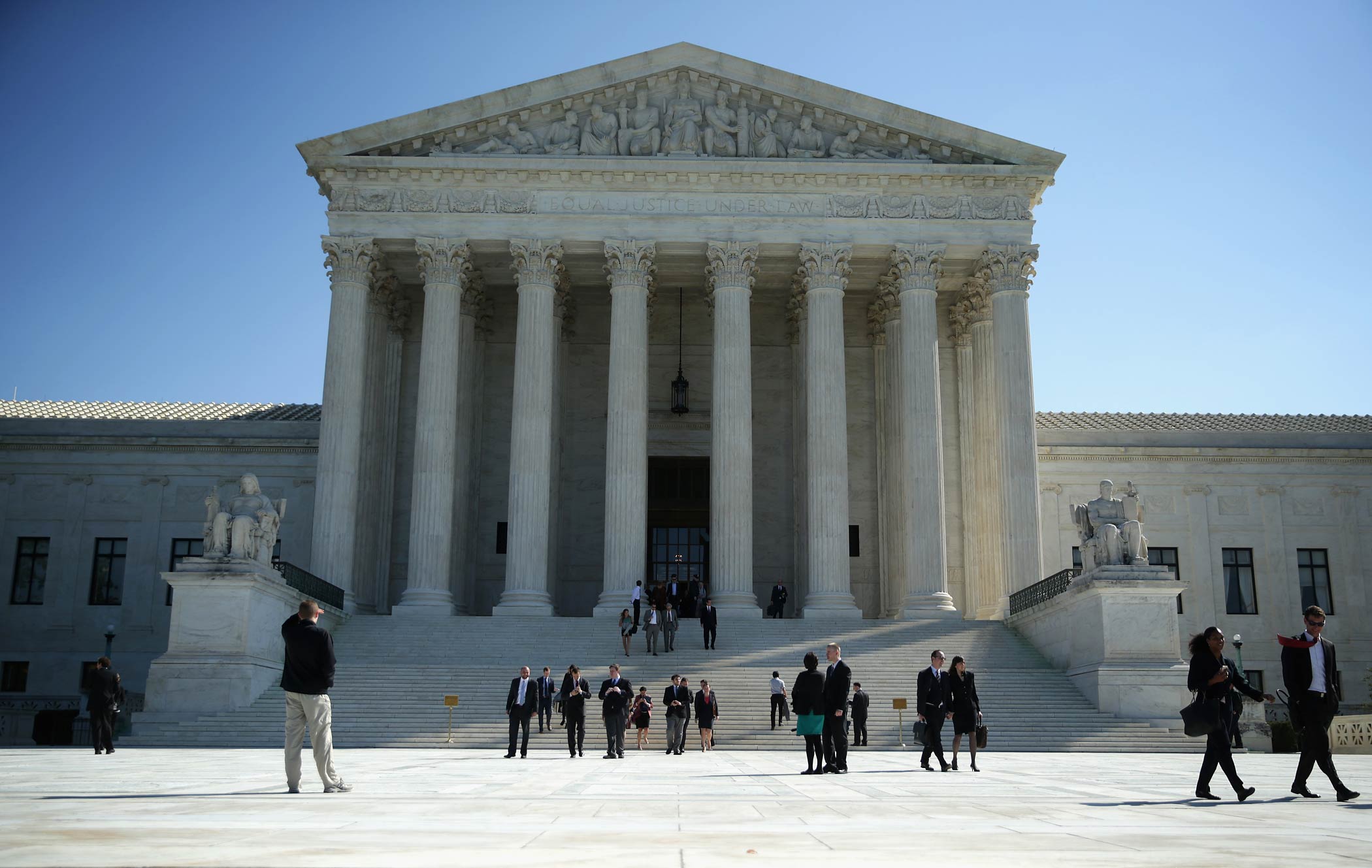 People come out from the U.S. Supreme Court on Oct. 6, 2014 in Washington, DC. (Alex Wong—Getty Images)