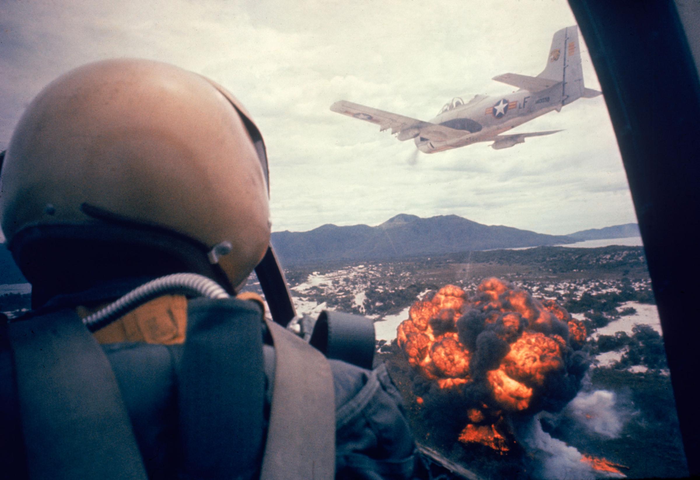 American jets drop napalm on Viet Cong positions early in the Vietnam conflict in 1963.