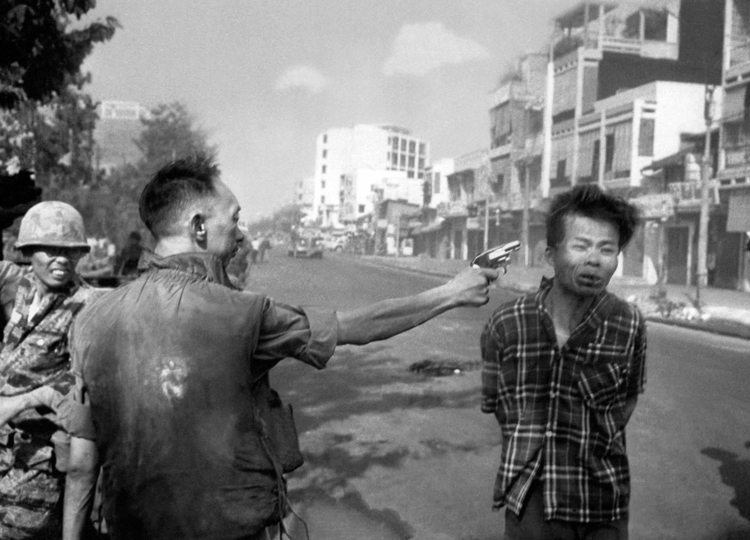 South Vietnamese General Nguyen Ngoc Loan, chief of the National Police, fires his pistol into the head of suspected Viet Cong officer Nguyen Van Lem (also known as Bay Lop) on a Saigon street on Feb. 1, 1968.