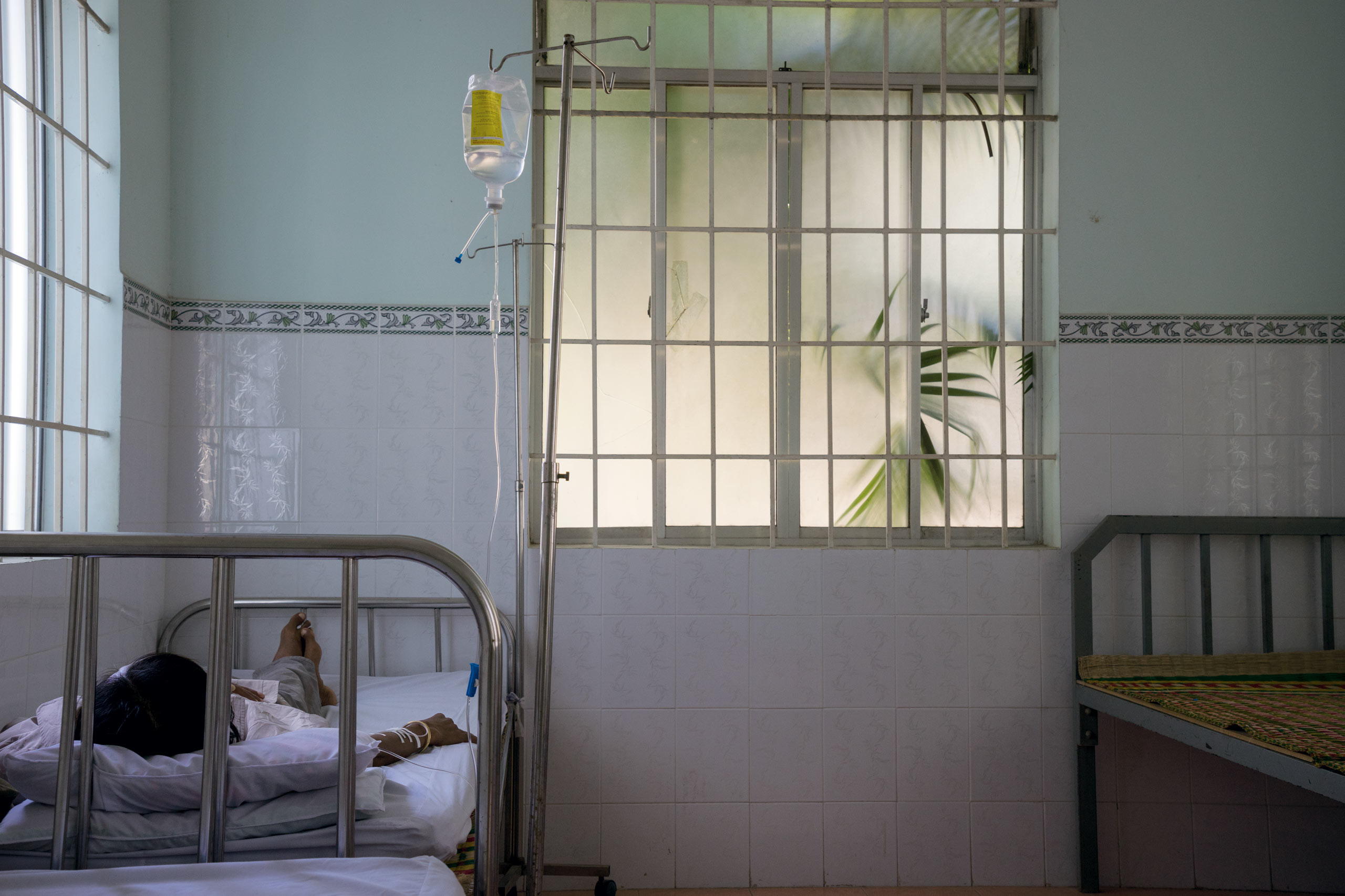 A patient receives an intravenous solution at a commune health center in Khanh Hoa Province, in Vietnam. Atlantic has constructed, rebuilt and provided medical equipment and supplies to over 50 Commune Health Centers in Khanh Hoa province alone.