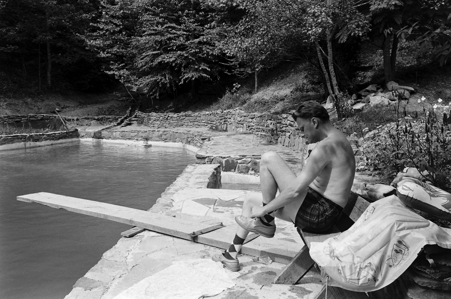 The Rev. Billy Graham beside his swimming pool, 1955.